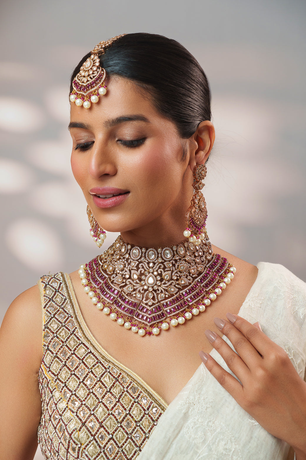 Bold and dramatic polki necklace set with matching earrings and maangtika