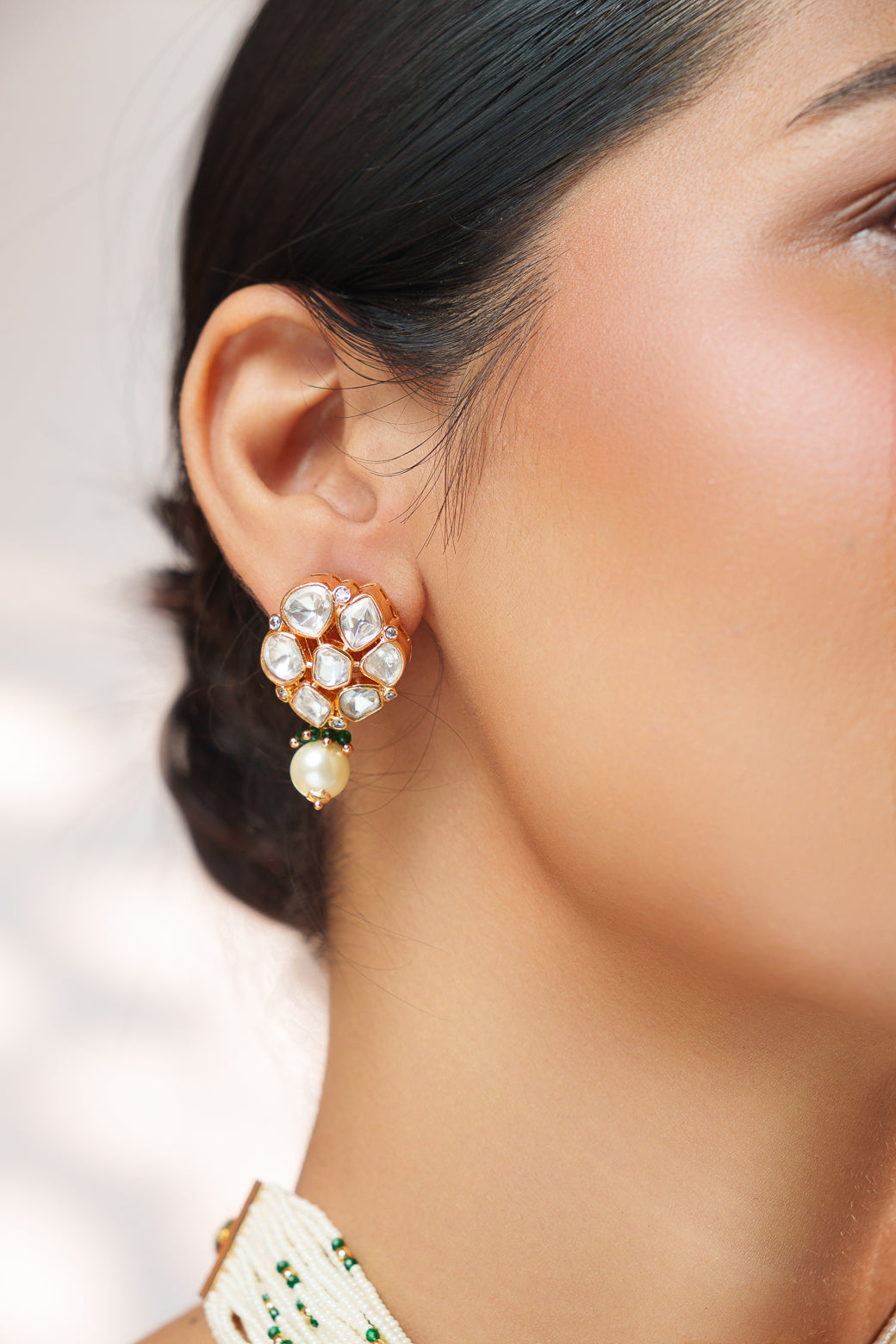 Classy kundan choker set with elegant pair of earrings.