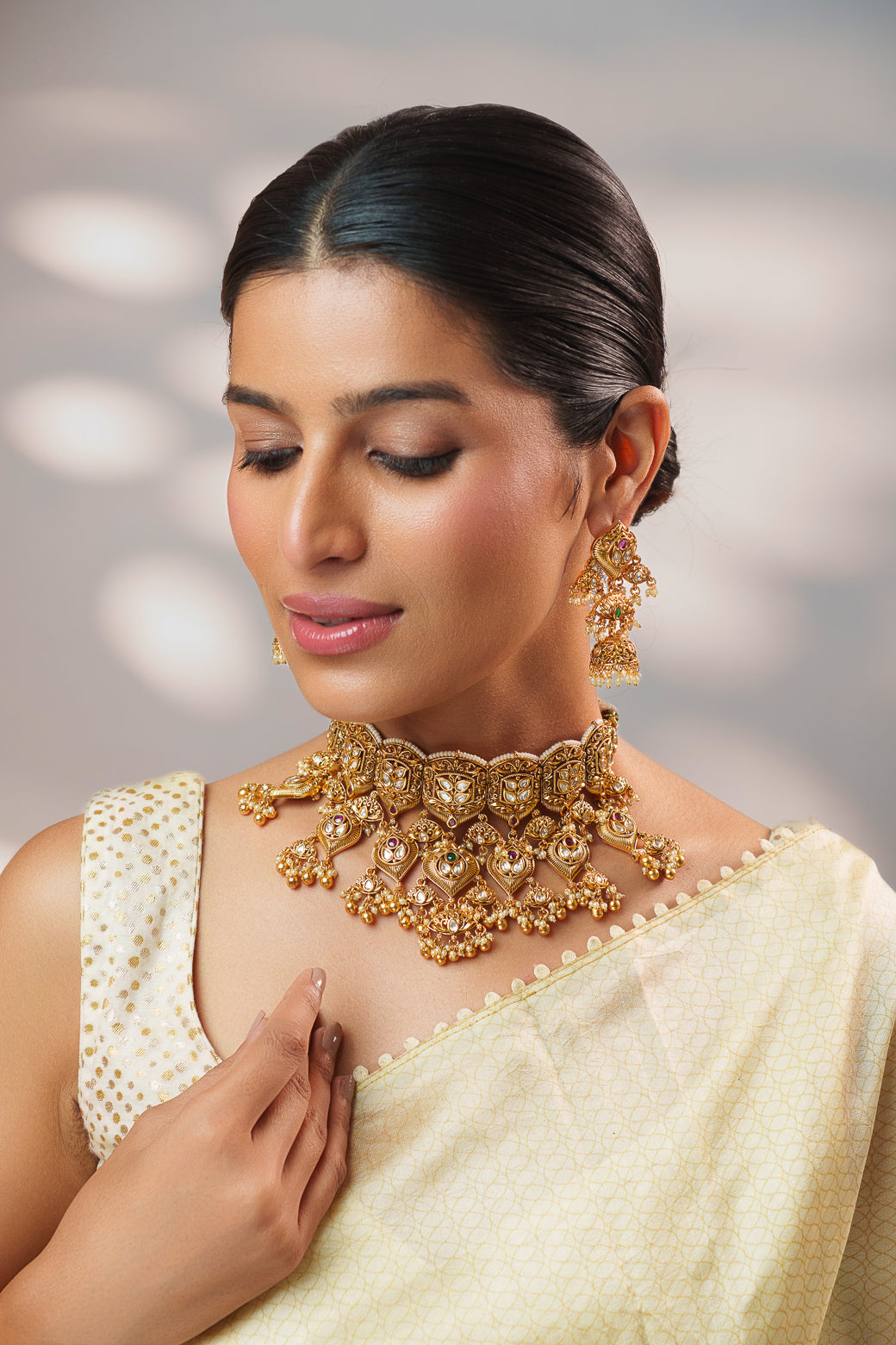 Traditional yet classic kundan temple necklace with elegant pair of earrings