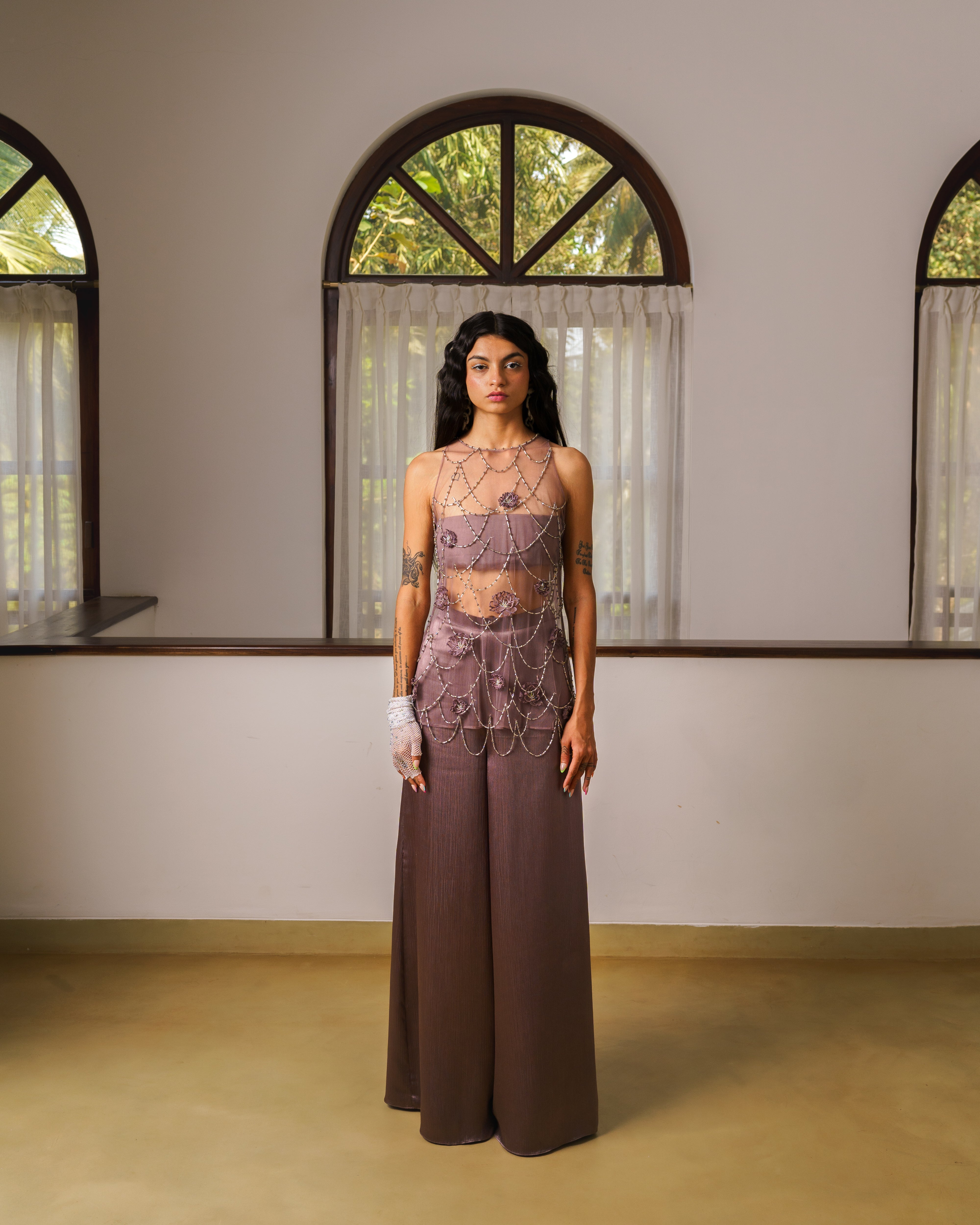 Short kurta top with hand embroidered tassels, bustier and flare pants