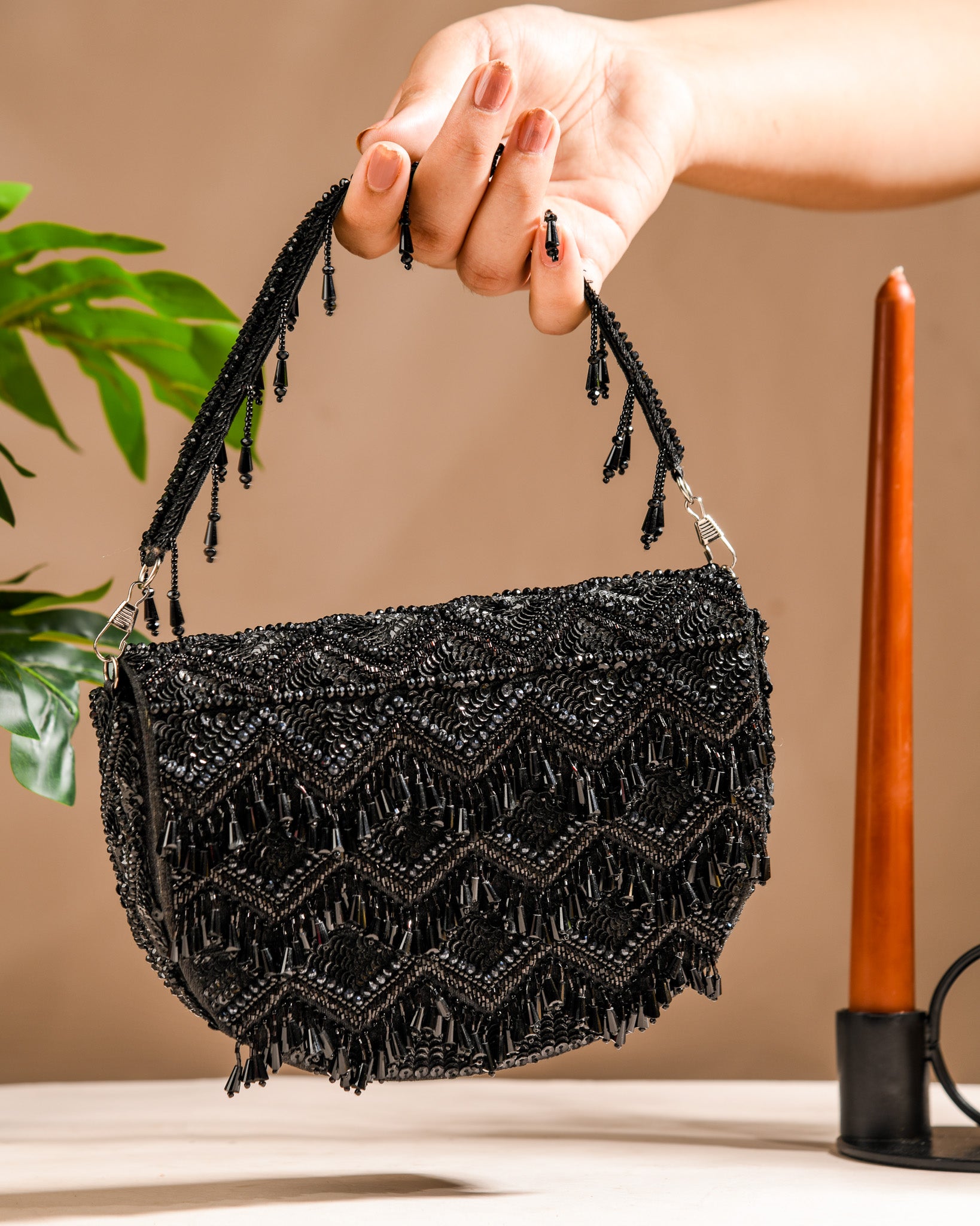 Black tasselly clutch