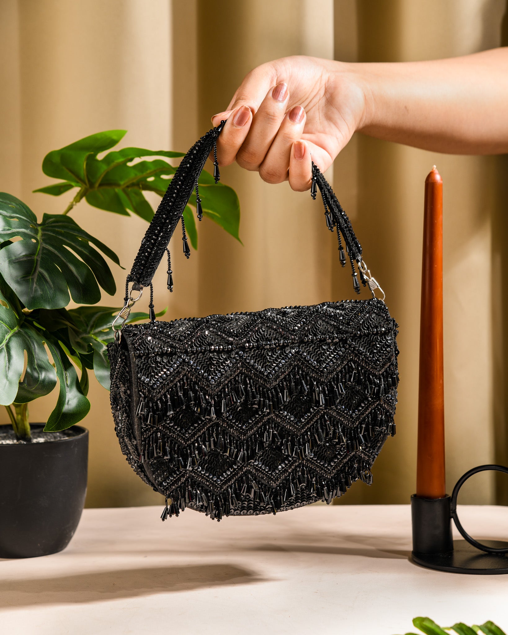 Black tasselly clutch