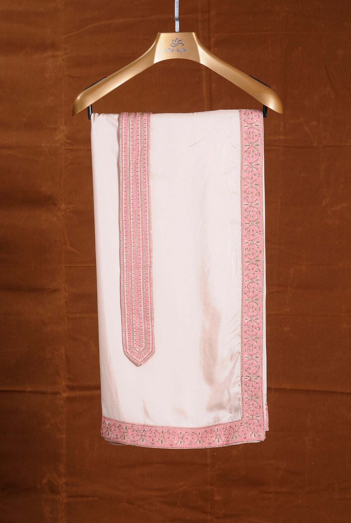 CORAL MATKA SILK SHERWANI ALL OVER EMBROIDERED WITH RESHAM AND BEADWORK WITH A BLUSH MONGA TUSSAR KURTA AND COTTON LYCRA TROUSERS