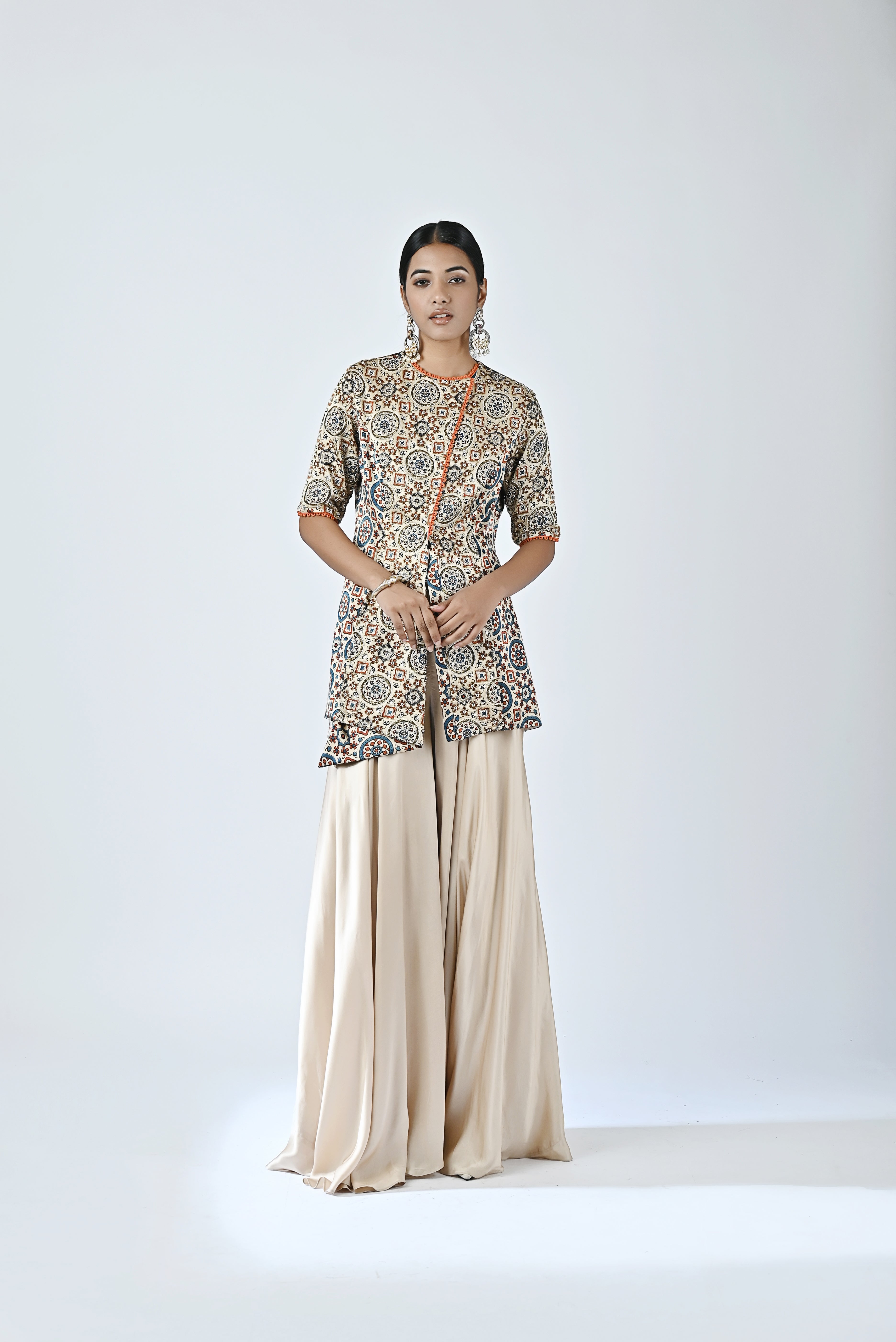 Beige embroidered jacket with flare pants