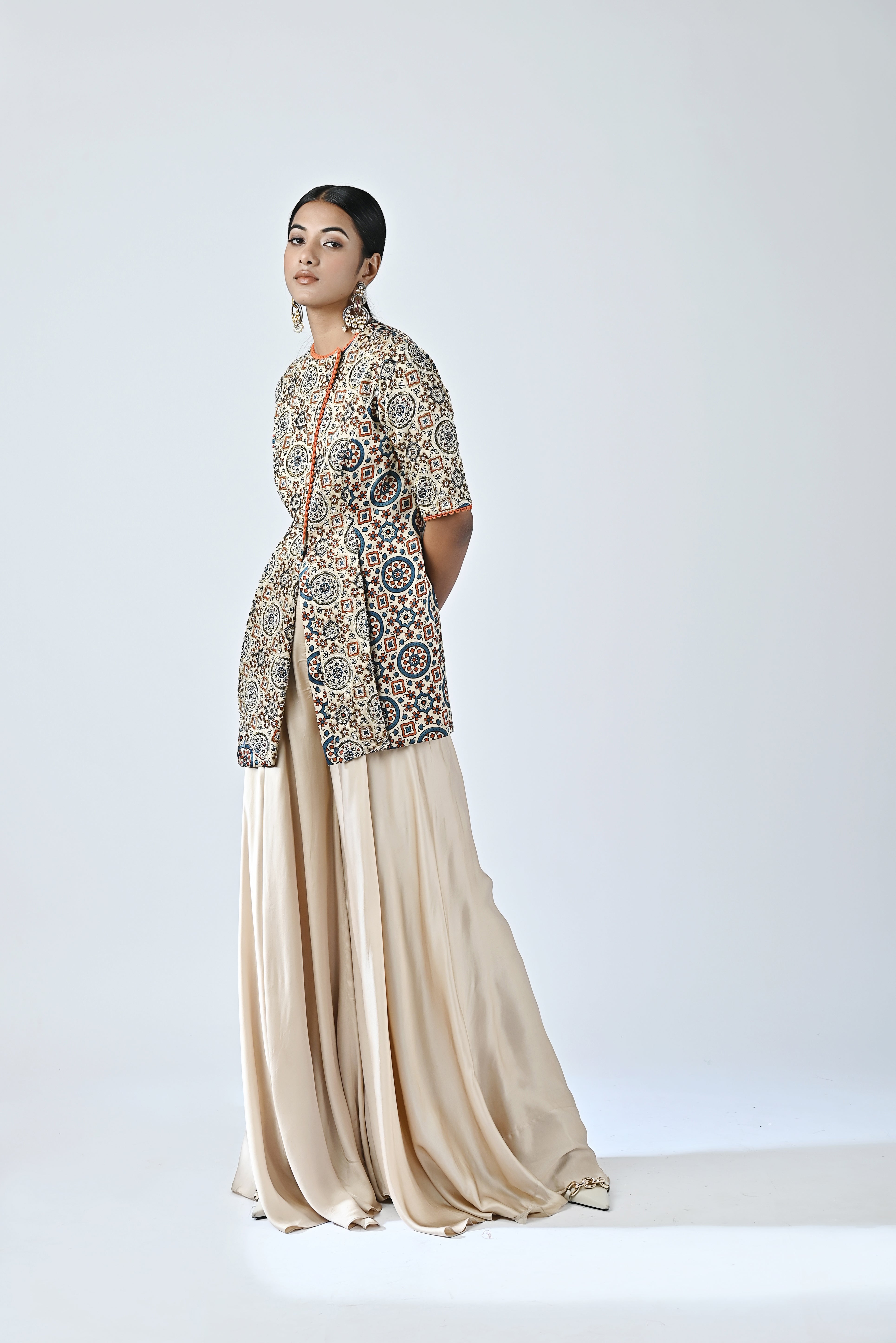 Beige embroidered jacket with flare pants