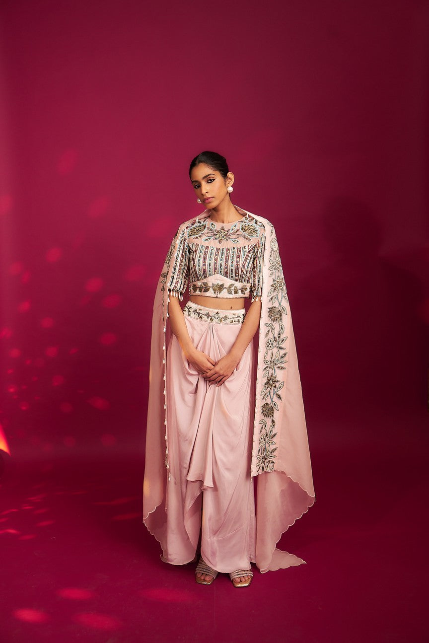 Peachy pink embellished ajrakh blouse with embroidered cape and dhoti