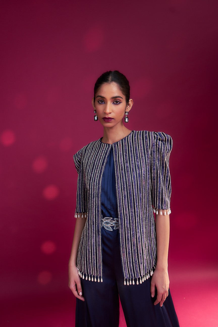 Deep blue side cowl jumpsuit with Ajrakh embellished jacket with patchwork waistbelt