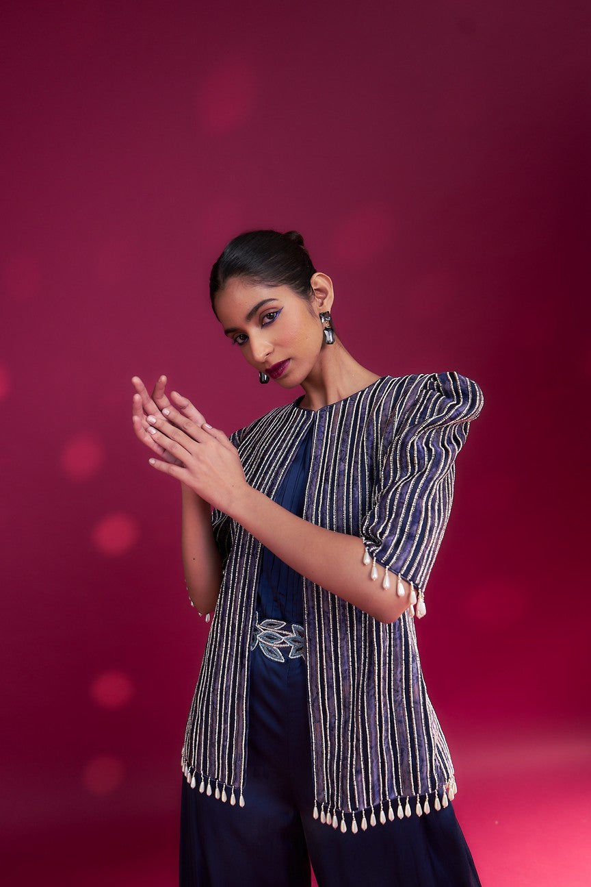 Deep blue side cowl jumpsuit with Ajrakh embellished jacket with patchwork waistbelt