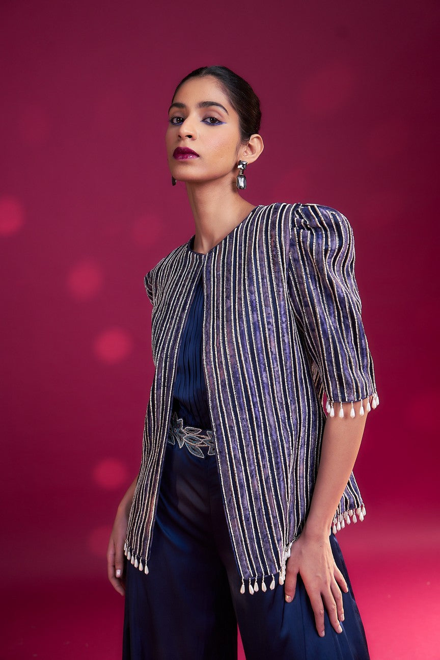 Deep blue side cowl jumpsuit with Ajrakh embellished jacket with patchwork waistbelt