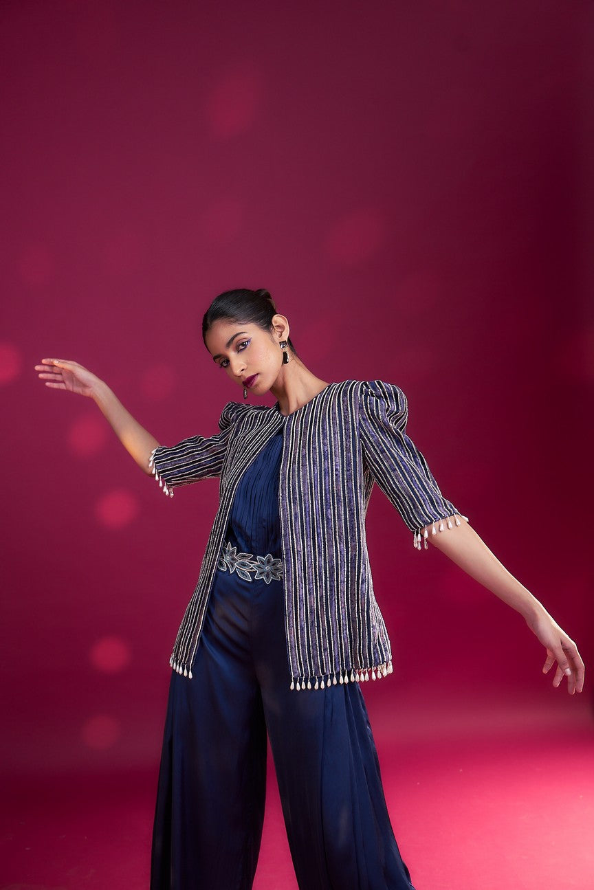 Deep blue side cowl jumpsuit with Ajrakh embellished jacket with patchwork waistbelt