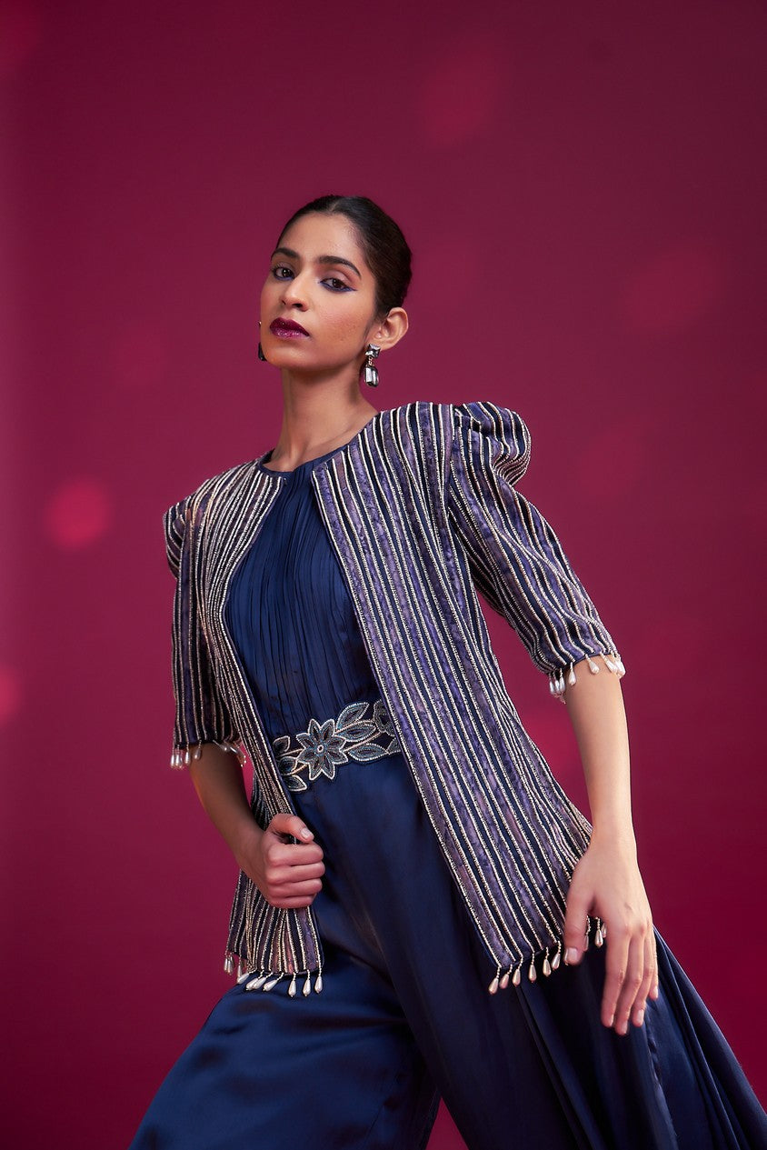 Deep blue side cowl jumpsuit with Ajrakh embellished jacket with patchwork waistbelt