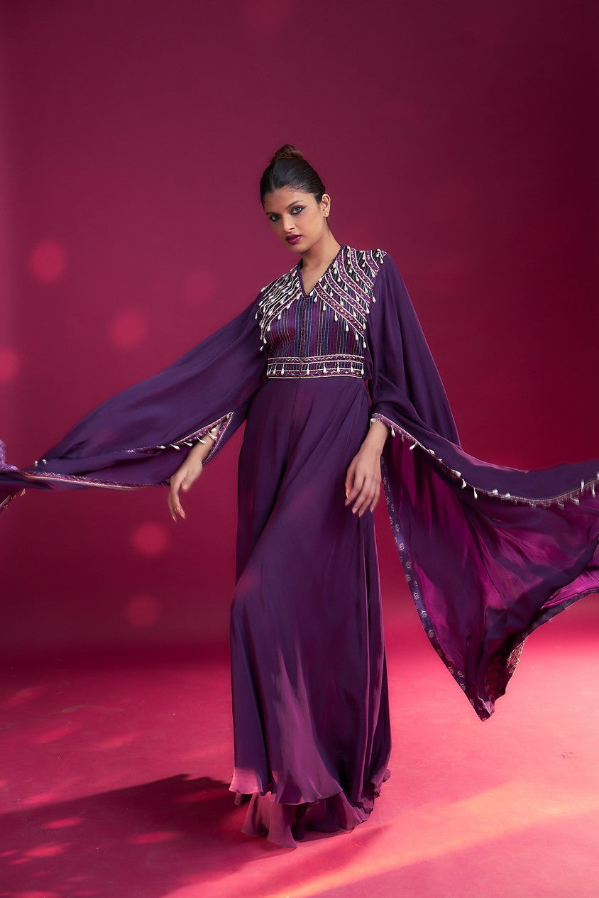 Purple heavily embellished jumpsuit with embroidered cape sleeves