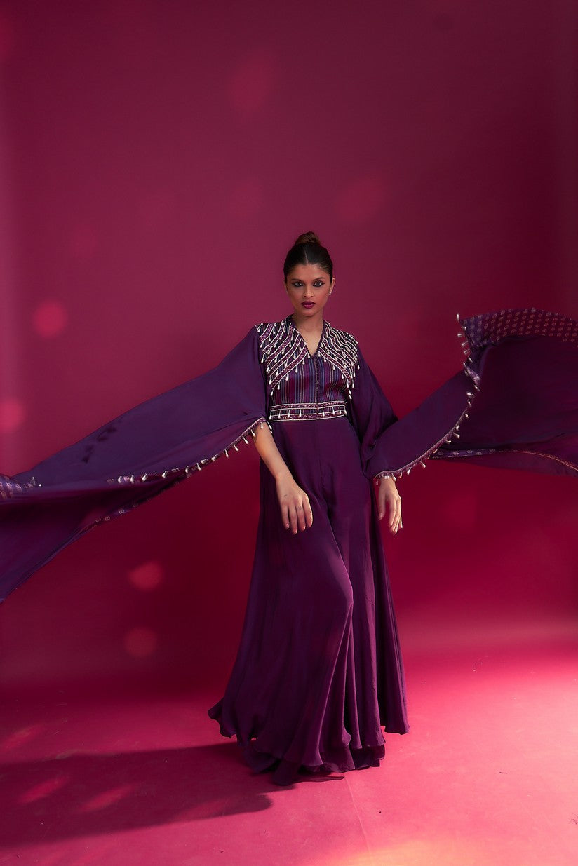 Purple heavily embellished jumpsuit with embroidered cape sleeves