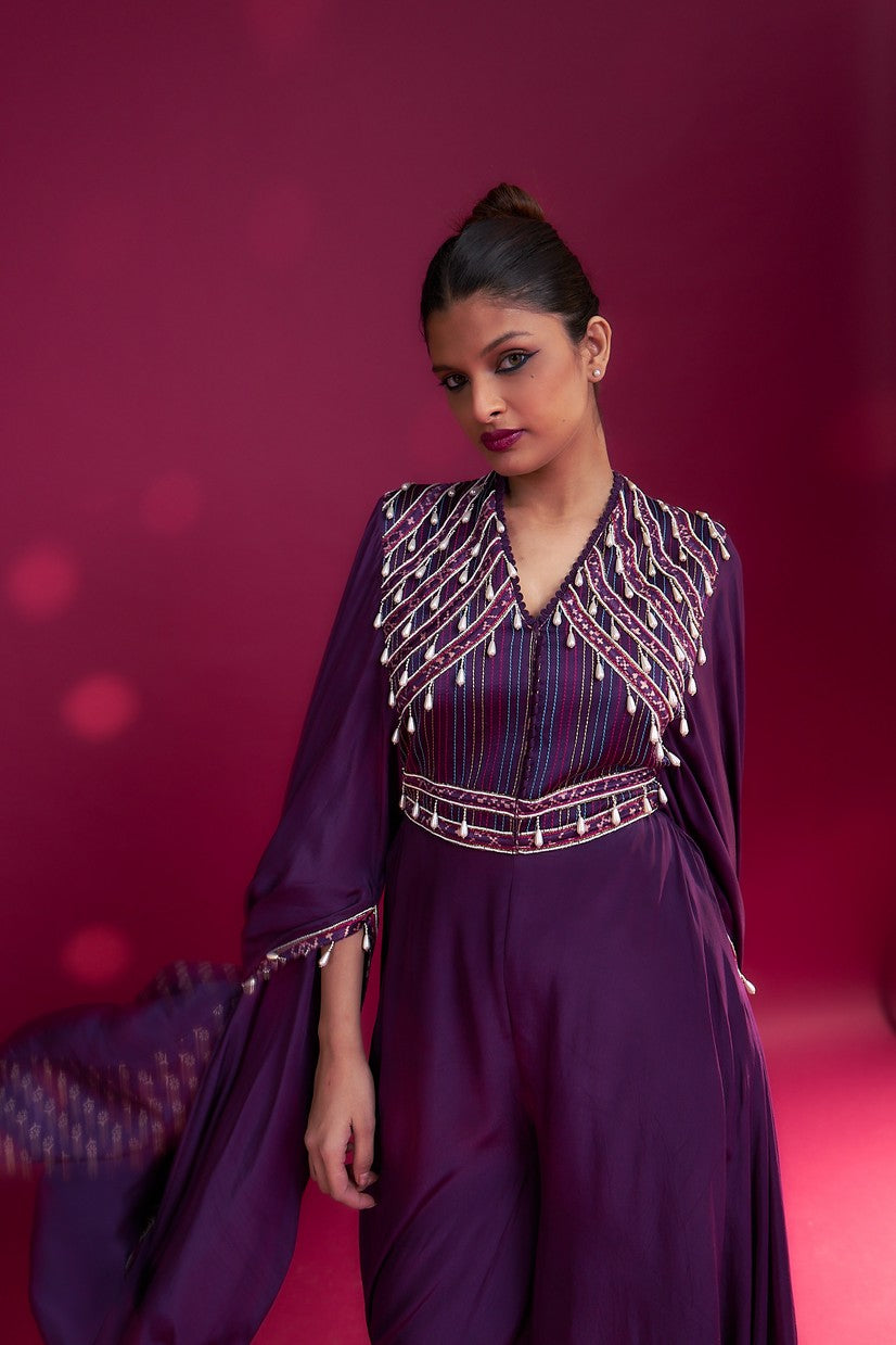 Purple heavily embellished jumpsuit with embroidered cape sleeves