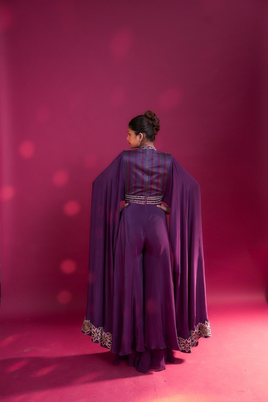 Purple heavily embellished jumpsuit with embroidered cape sleeves