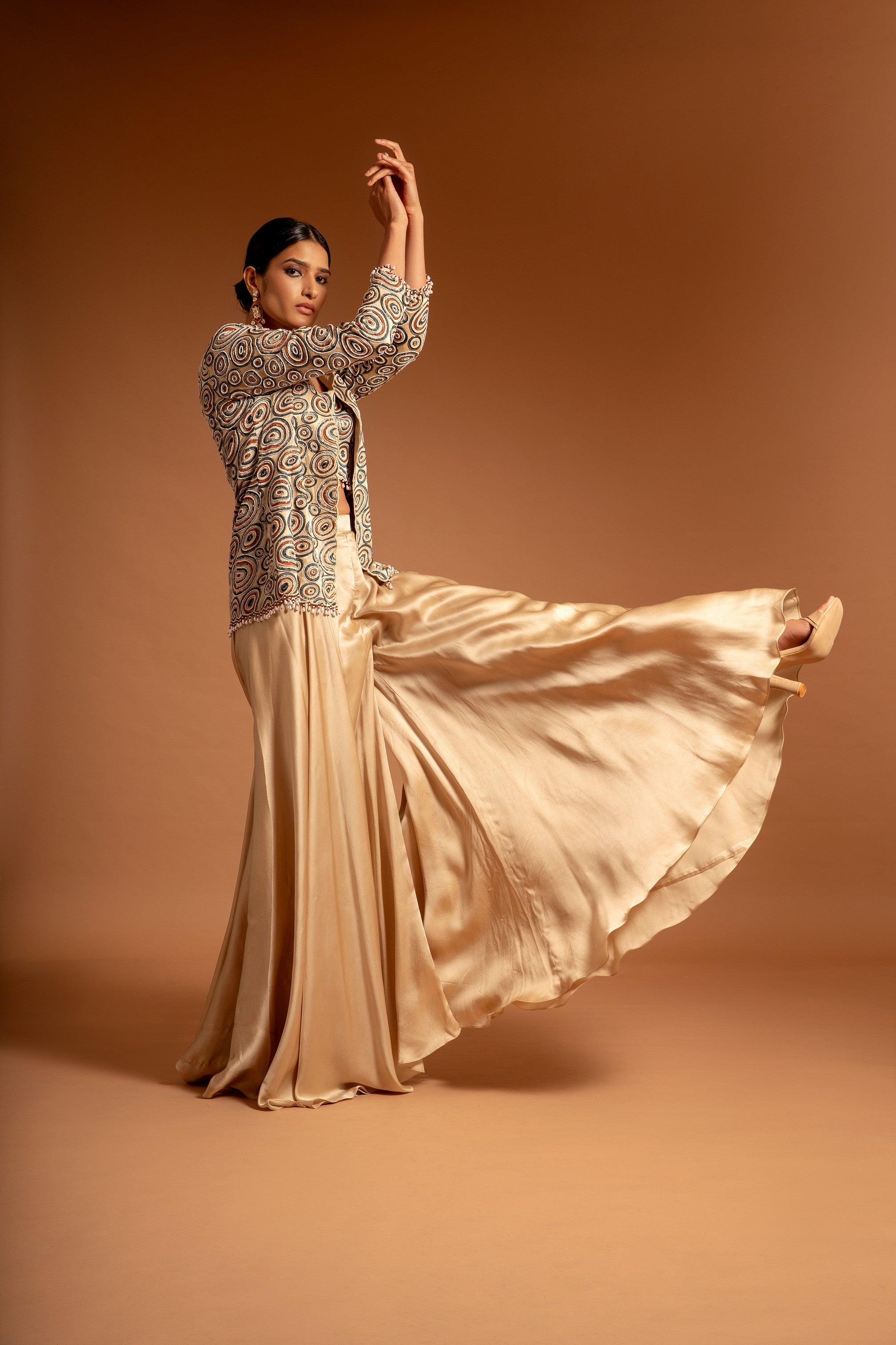 Beige fully handcrafted blouse and ajrakh jacket with flare pants