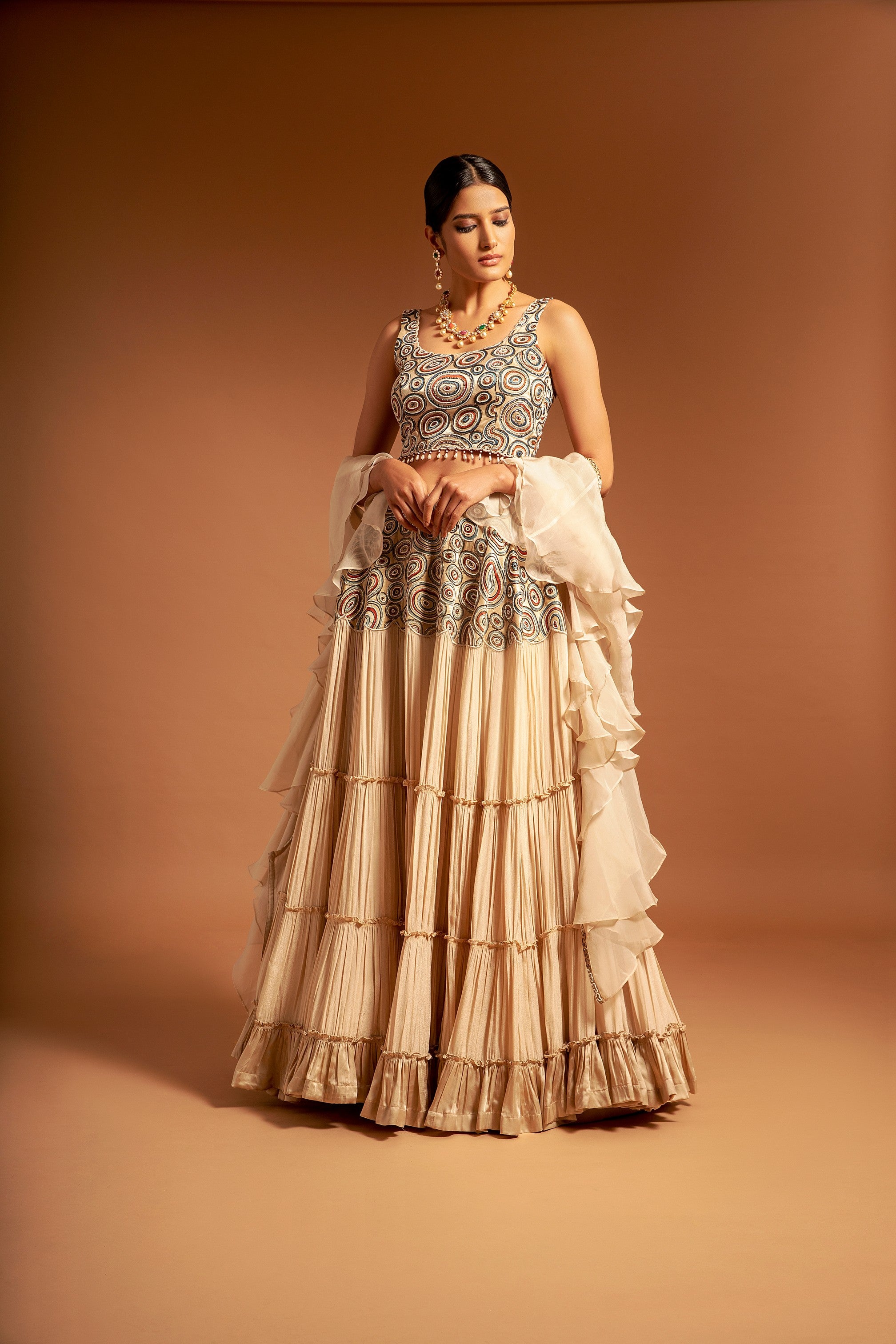 Beige fully embroidered ajrakh blouse with tiered lehenga and ruffle dupatta set