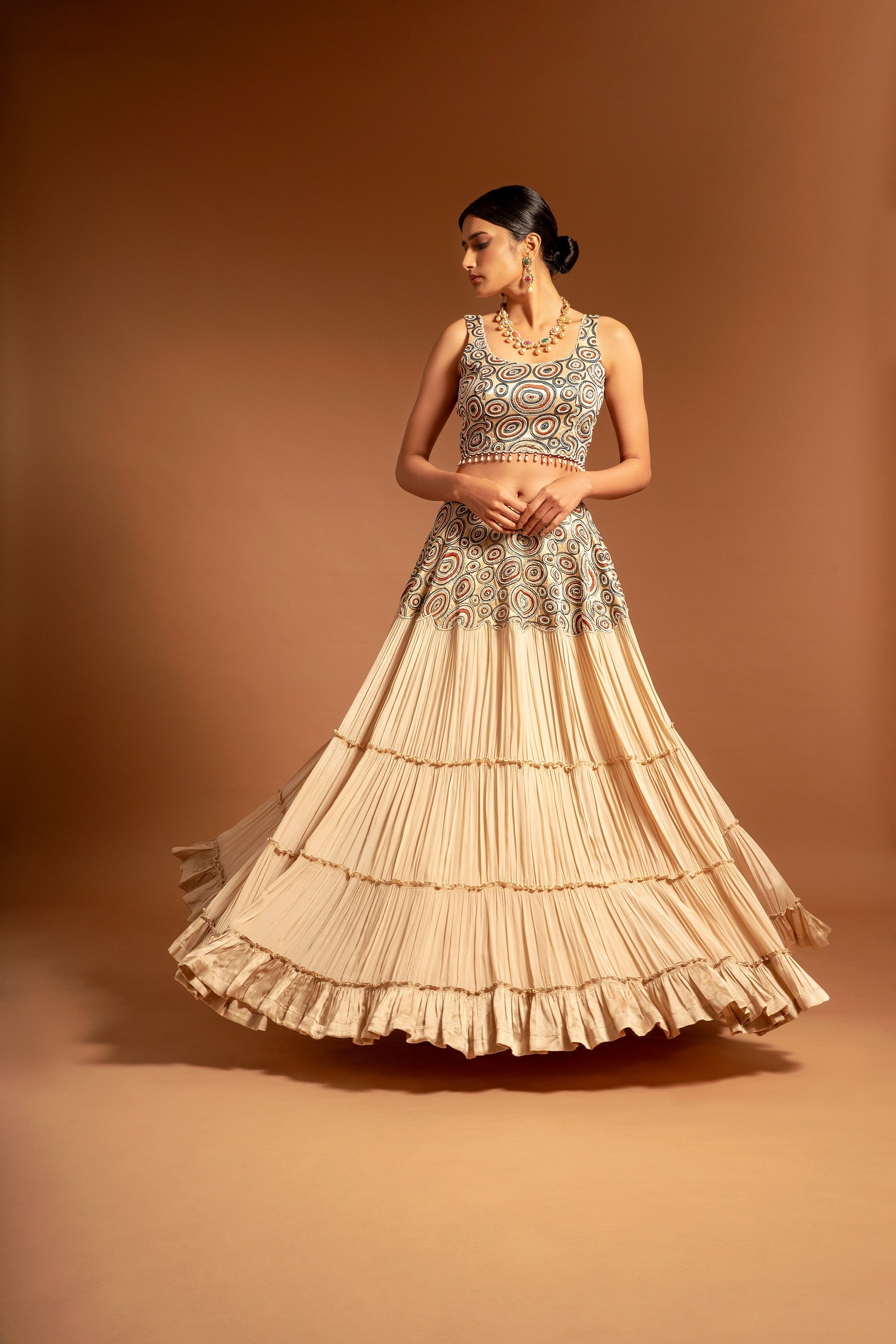 Beige fully embroidered ajrakh blouse with tiered lehenga and ruffle dupatta set