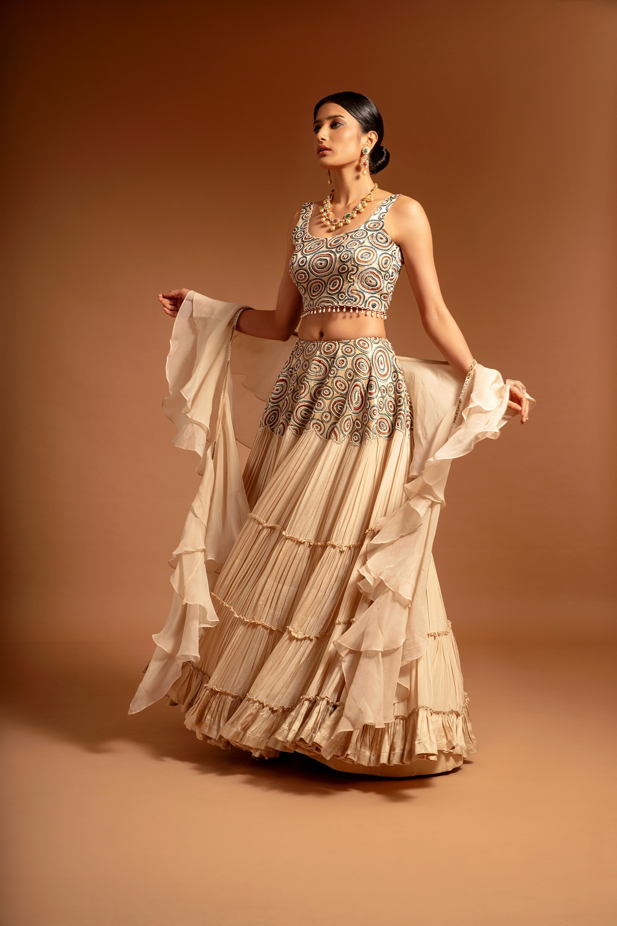 Beige fully embroidered ajrakh blouse with tiered lehenga and ruffle dupatta set