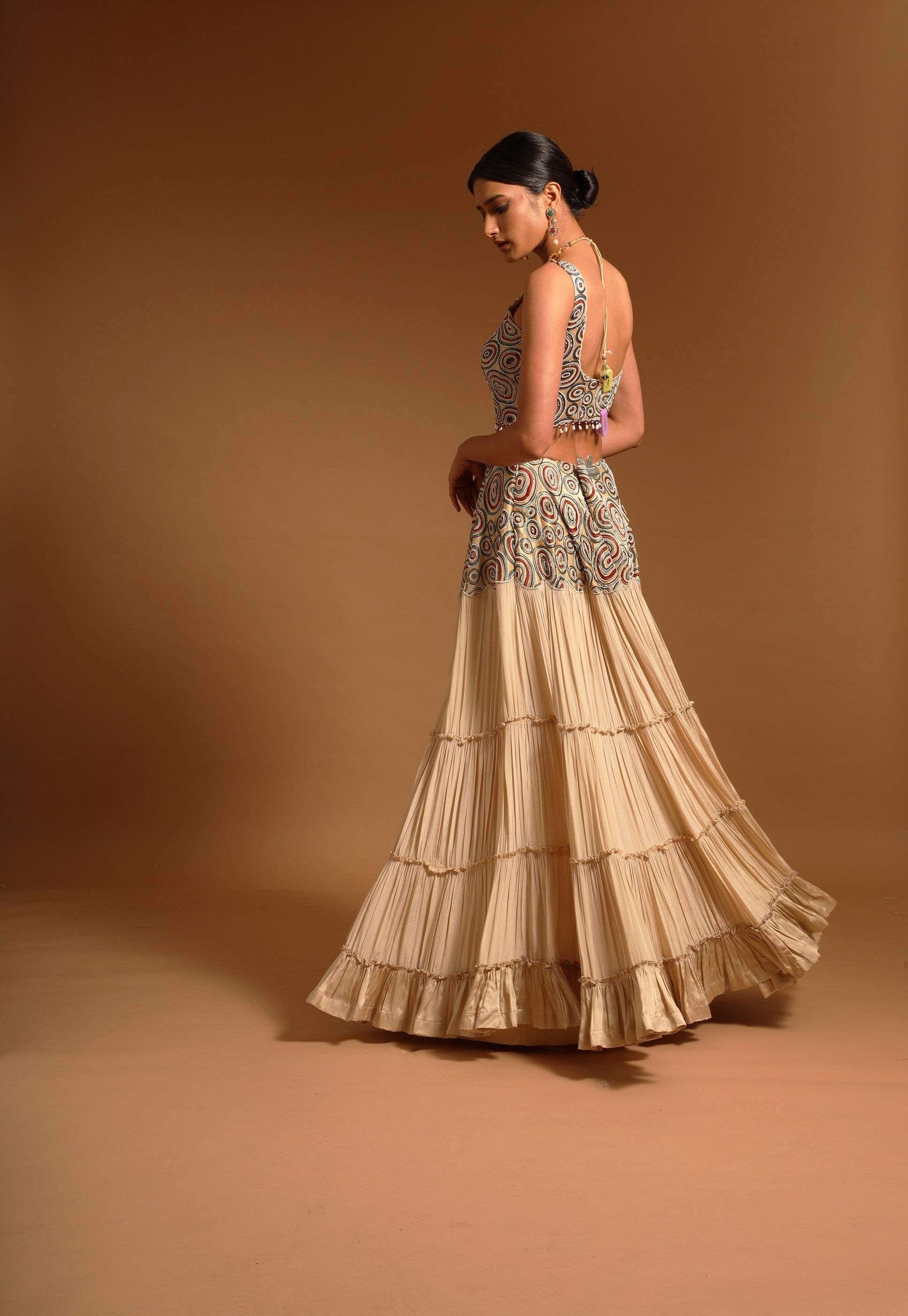 Beige fully embroidered ajrakh blouse with tiered lehenga and ruffle dupatta set