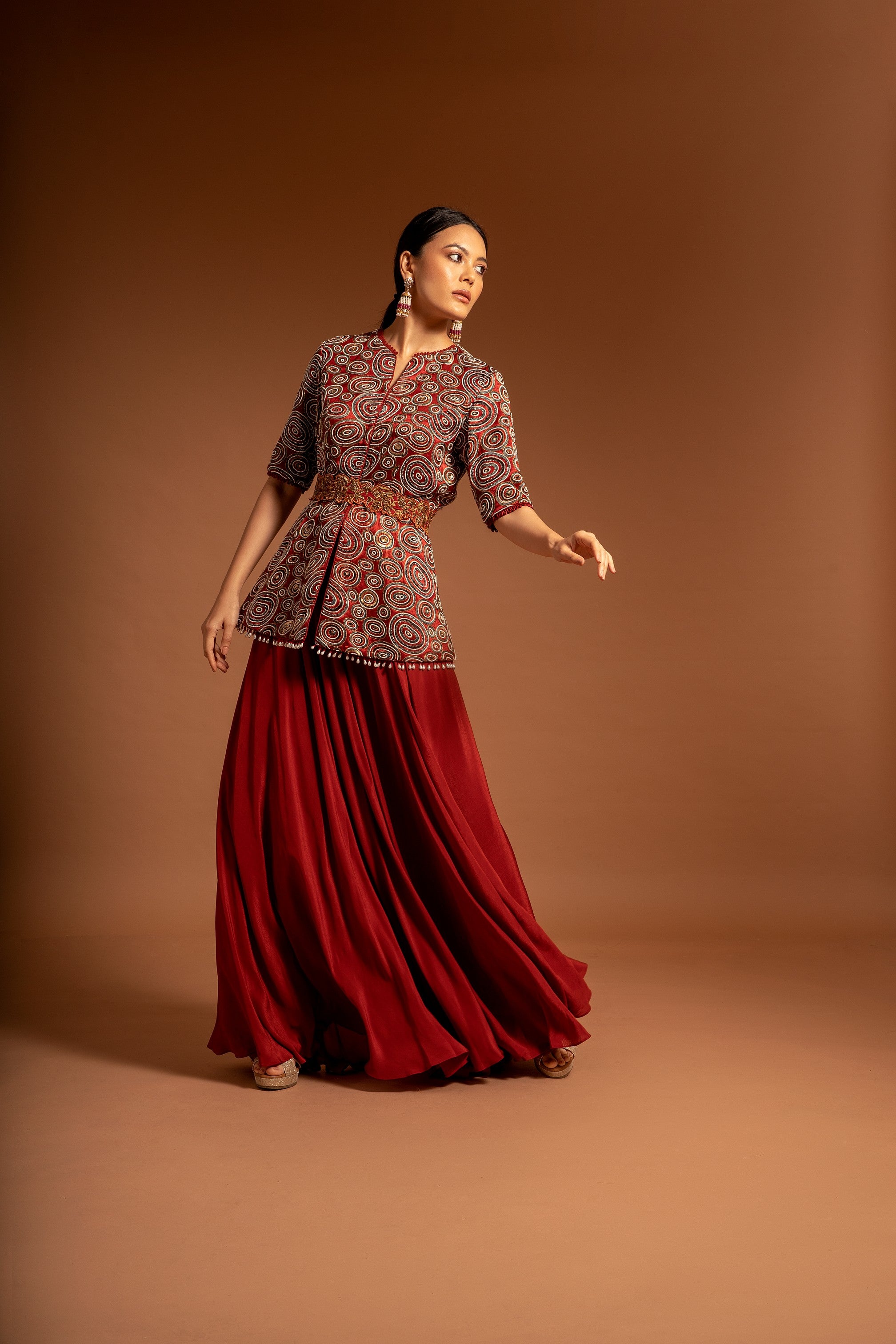 Red embroidered ajarkh peplum top with flare pants and embroidered waistbelt