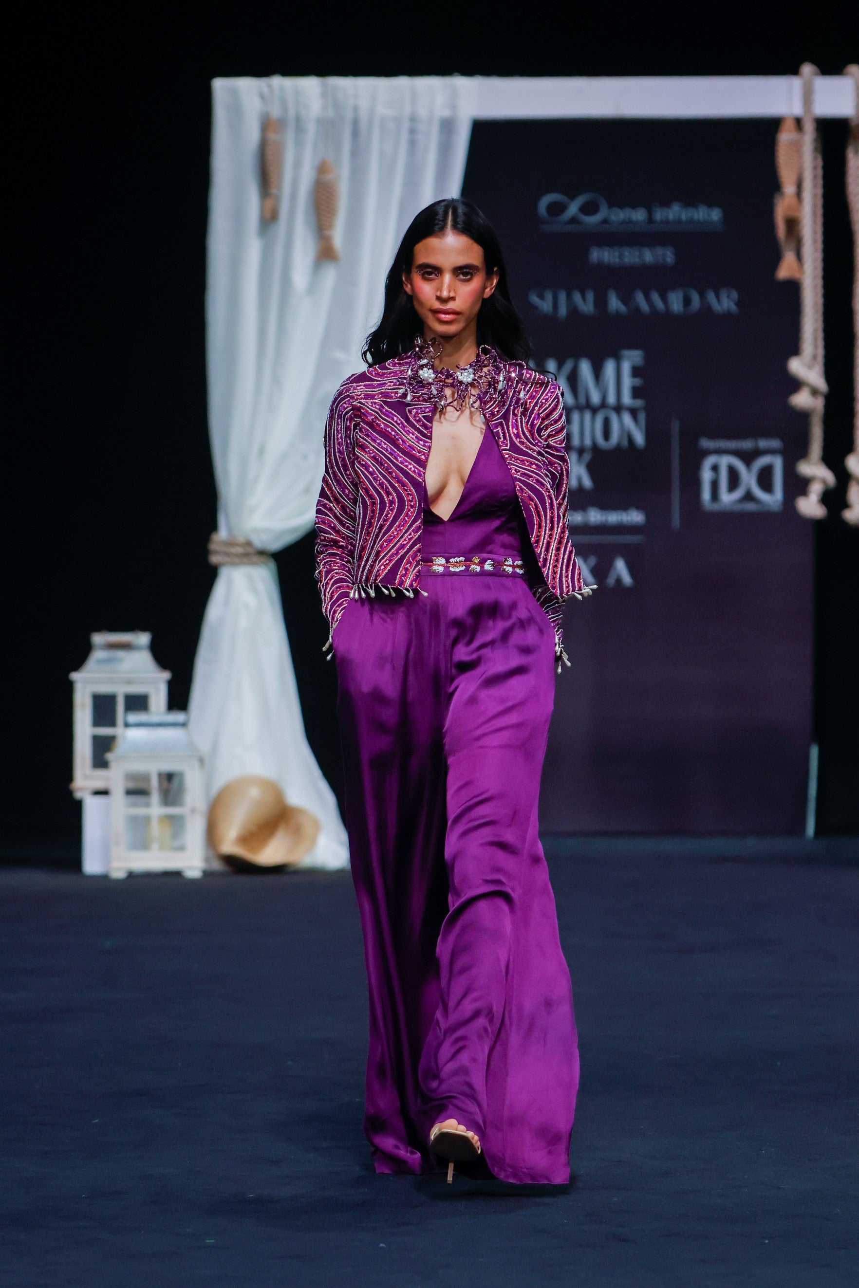 Dark purple deep V neck jumpsuit with Ajrakh ebellsihed jacket