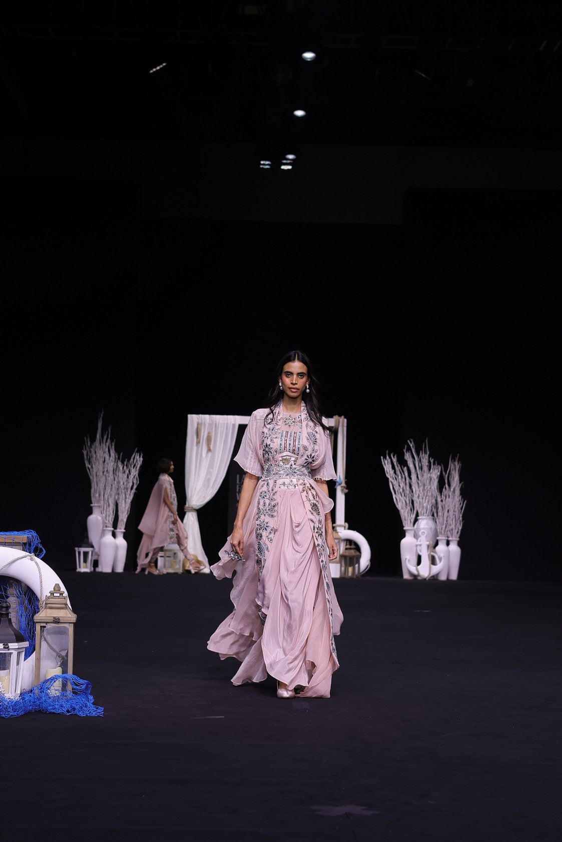 Peachy pink Ajrakh embroidered blouse paired up with Dhoti and ruffled dupatta
