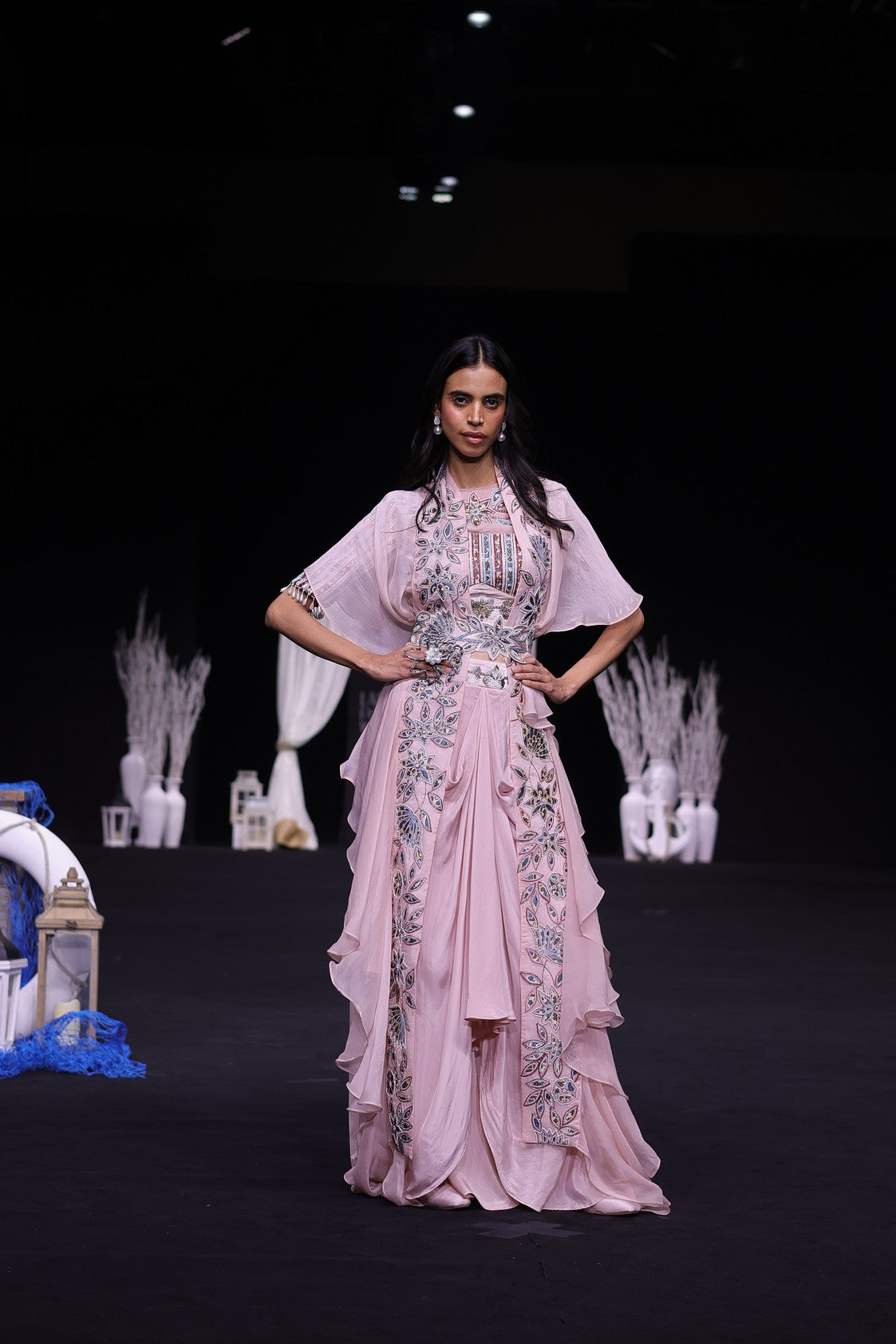 Peachy pink Ajrakh embroidered blouse paired up with Dhoti and ruffled dupatta