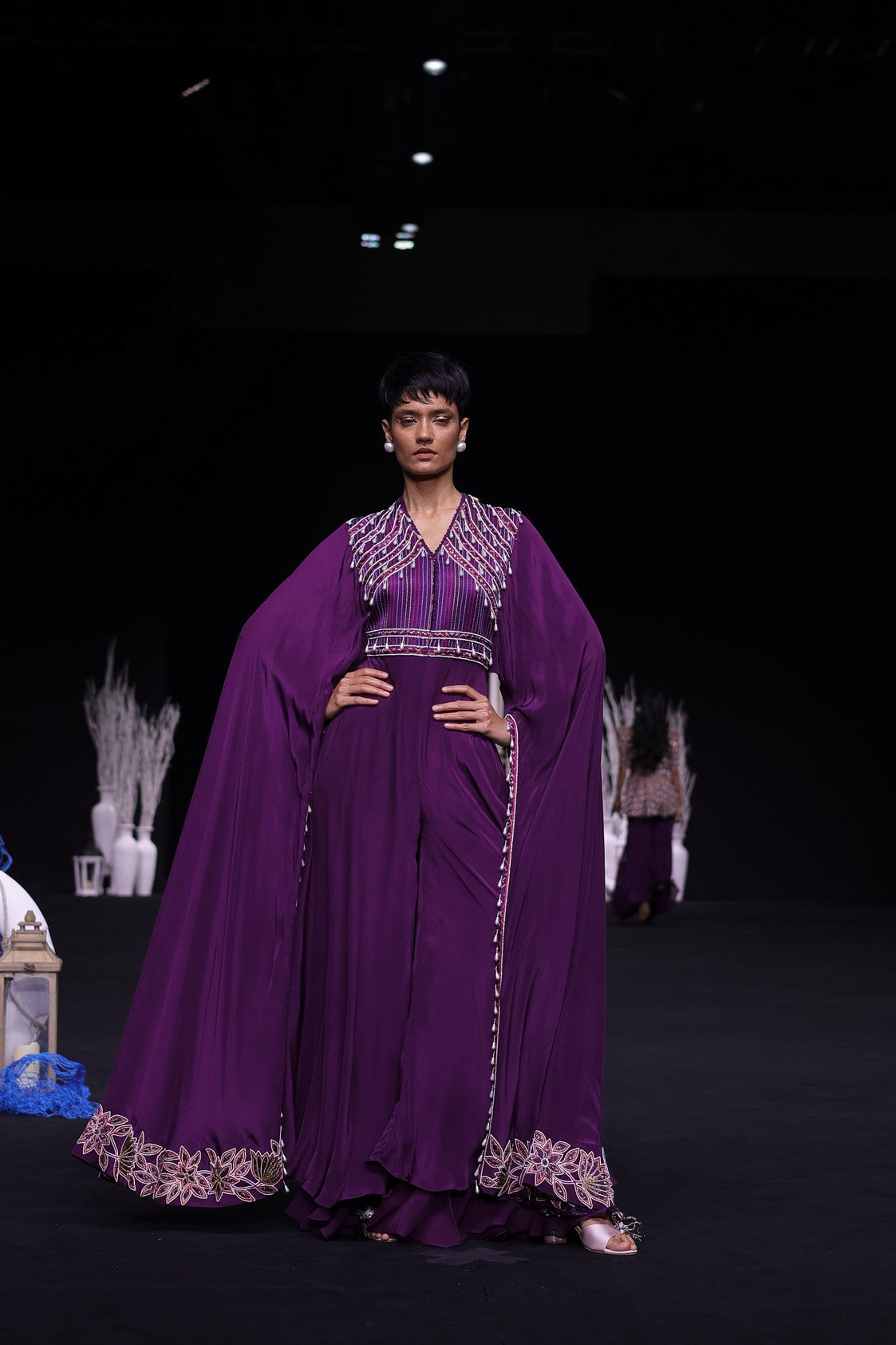 Purple heavily embellished jumpsuit with embroidered cape sleeves