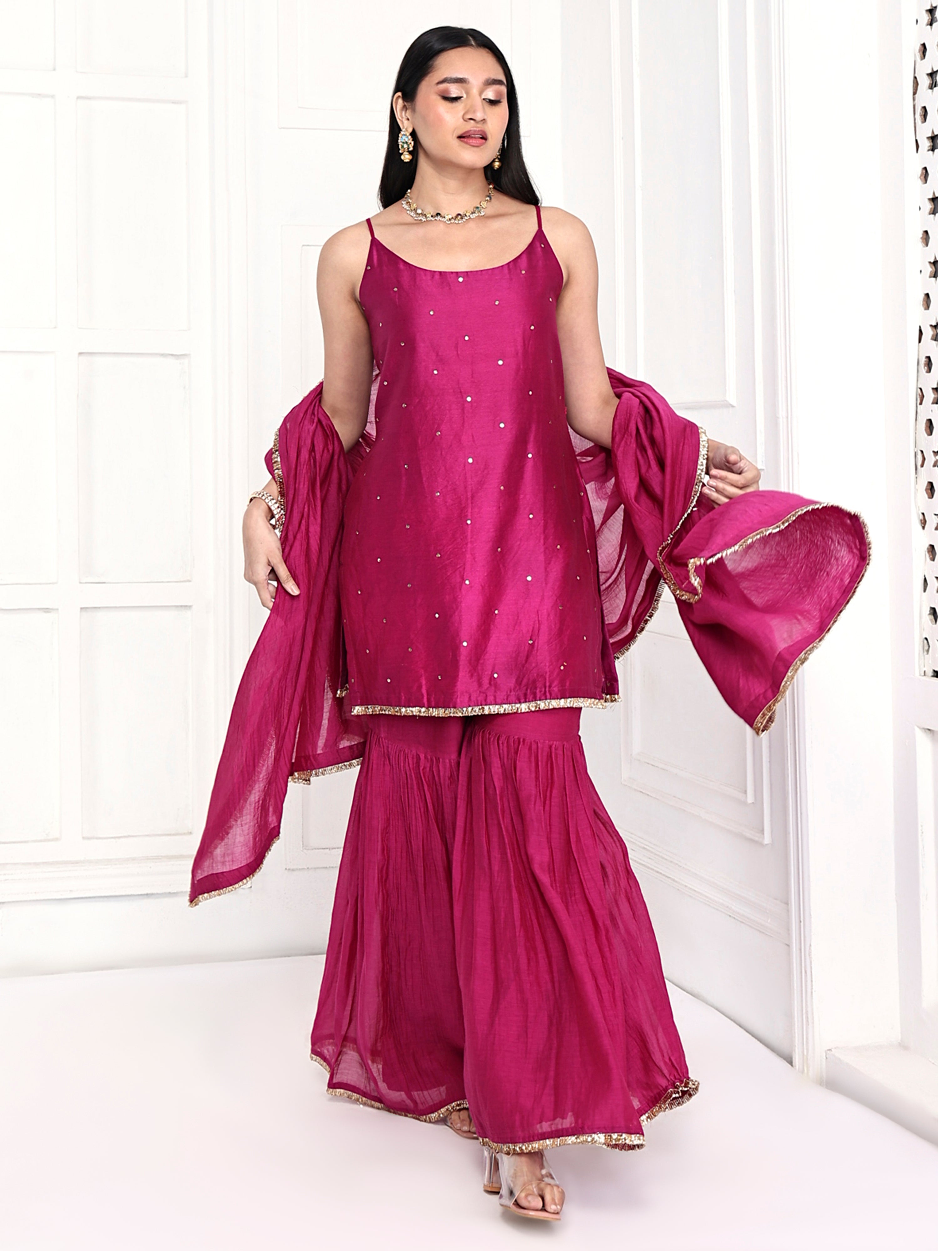 Strappy tunic is paired with garara and dupatta