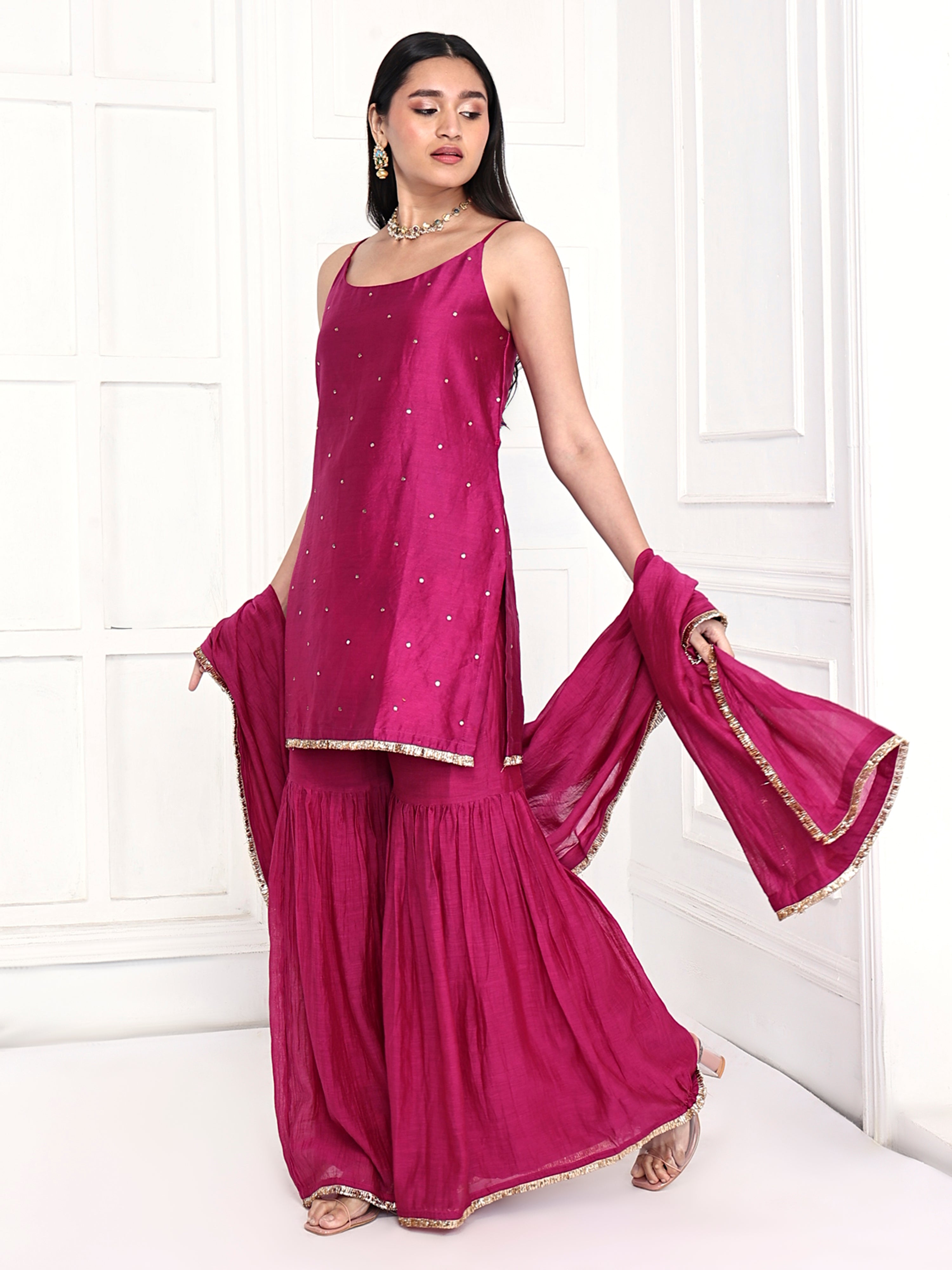 Strappy tunic is paired with garara and dupatta