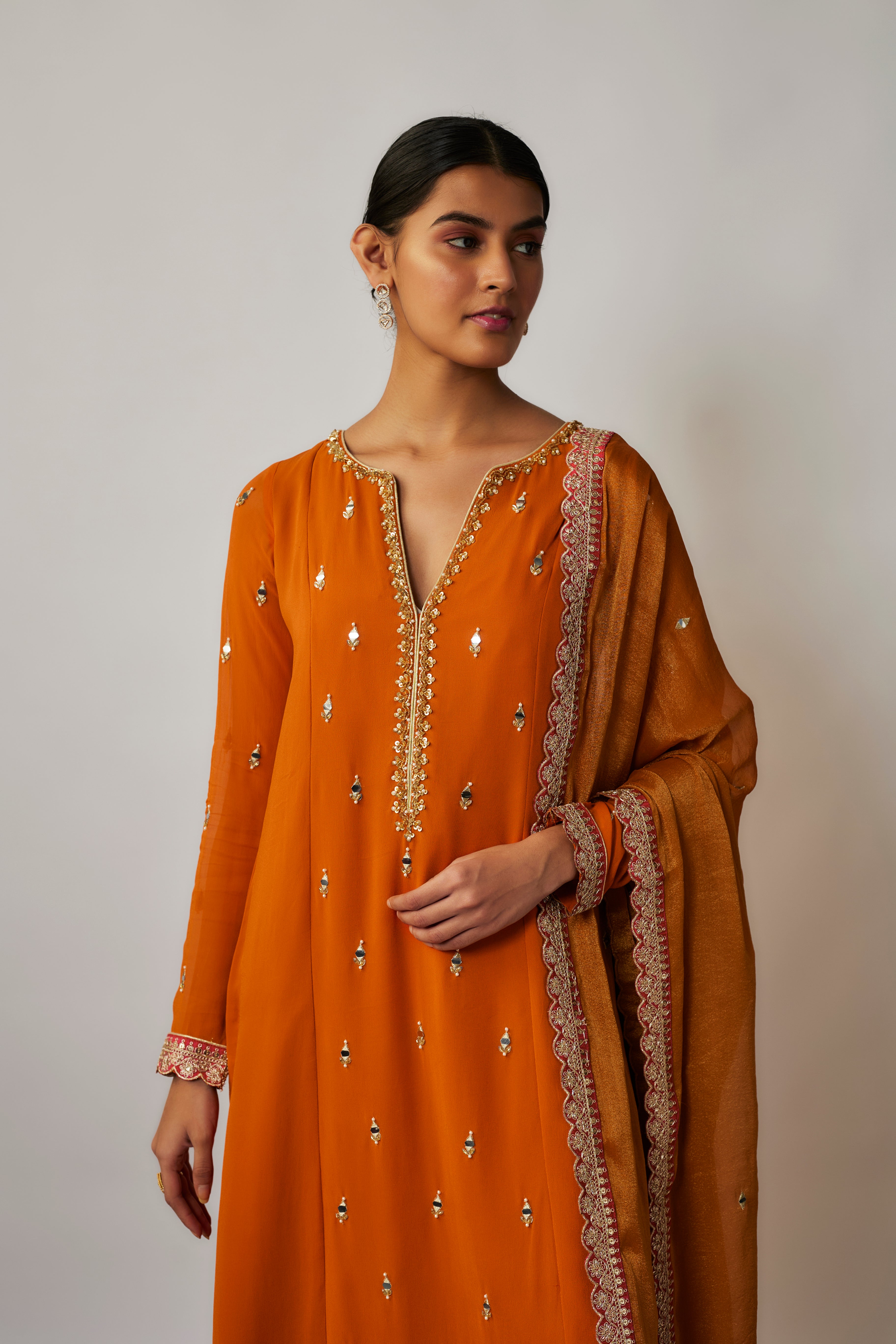 Saffron orange mirror, sequin and thread embroidered georgette suit set