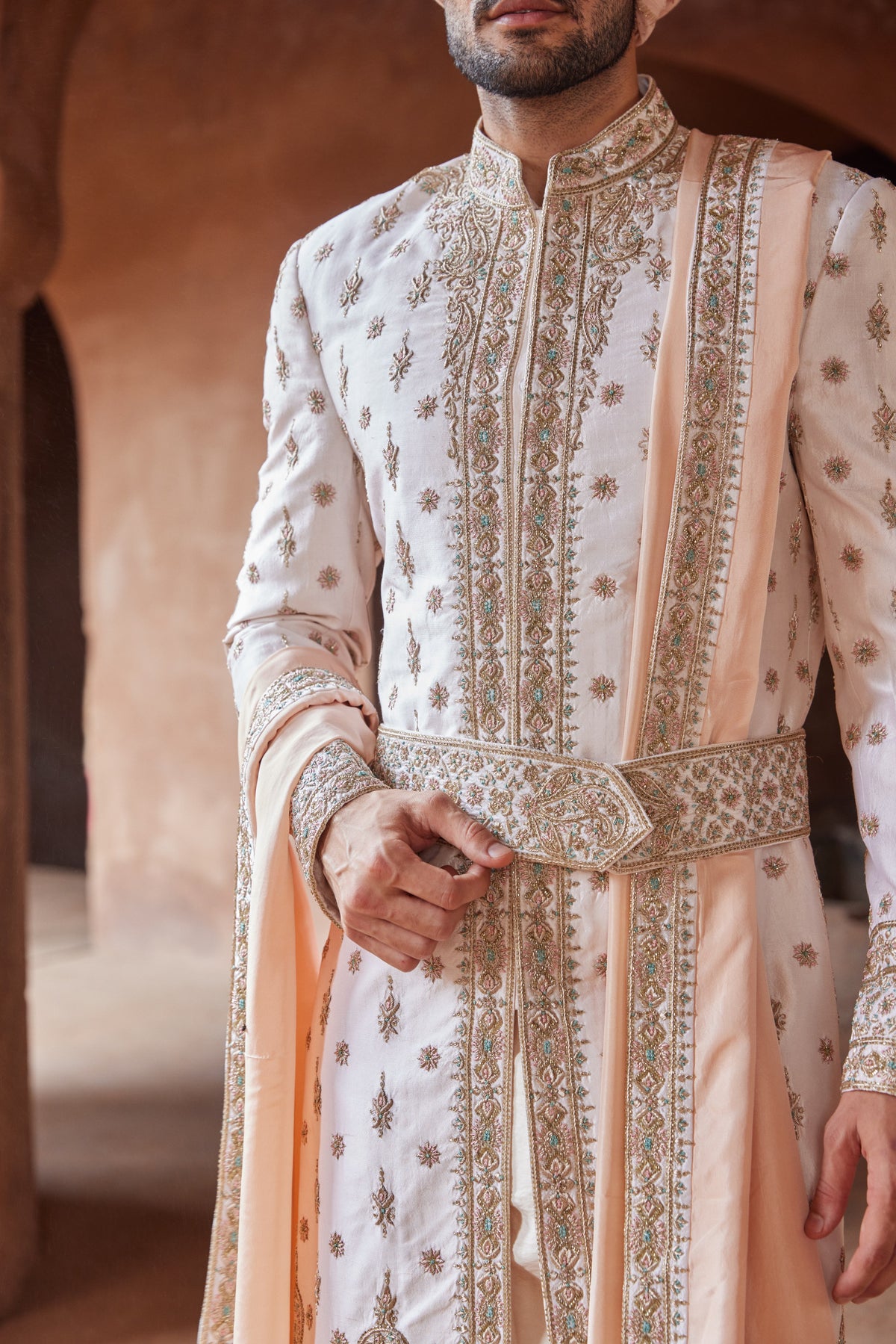 BLUSH PINK TAFETTA SILK EMBROIDERED SHERWANI WITH A MONGA TUSSAR KURTA AND COTTON LYCRA TROUSER