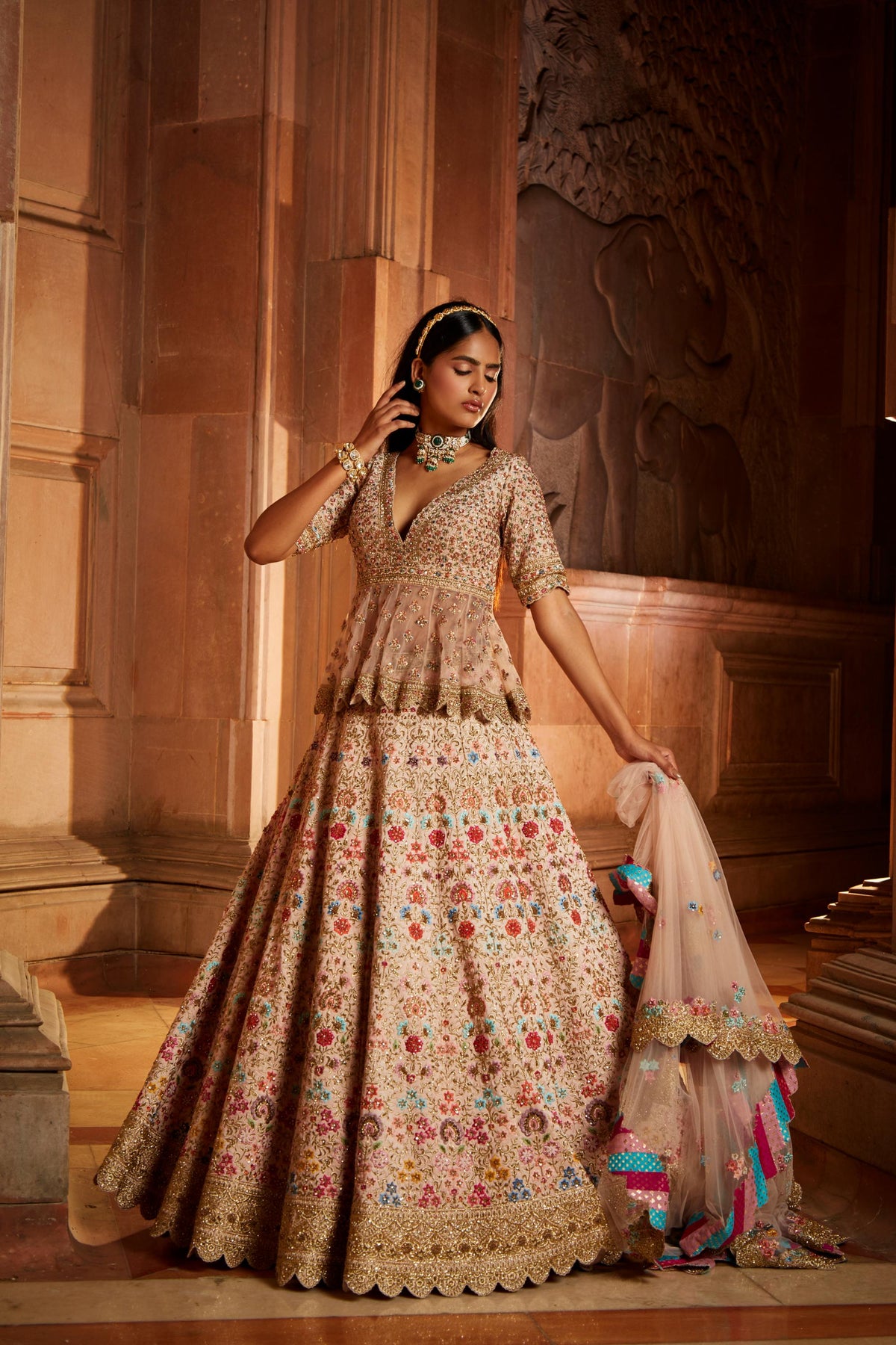 Blush Pink Raw Silk Lehenga with a Peplum Top and Tulle Dupatta