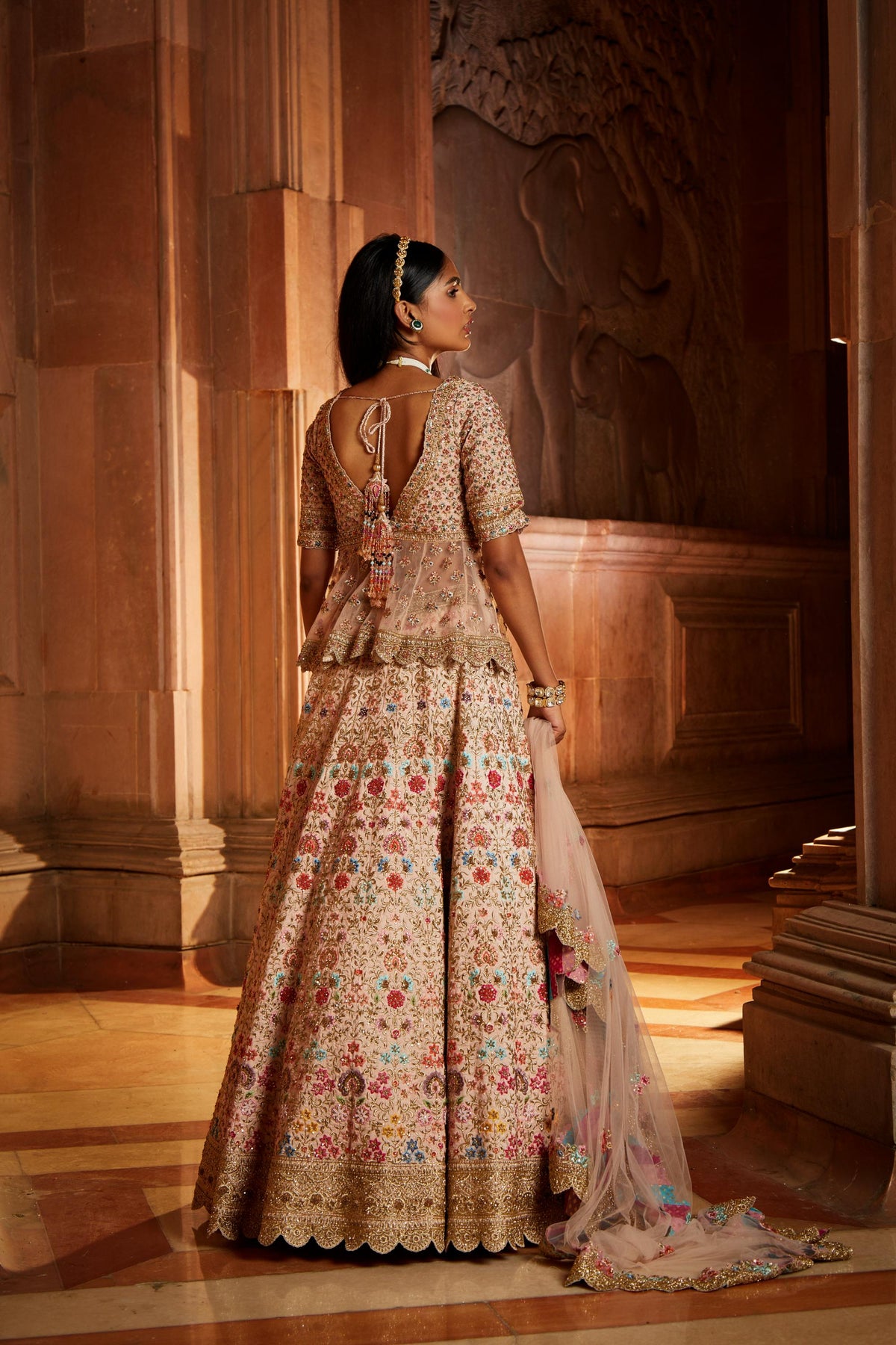 Blush Pink Raw Silk Lehenga with a Peplum Top and Tulle Dupatta