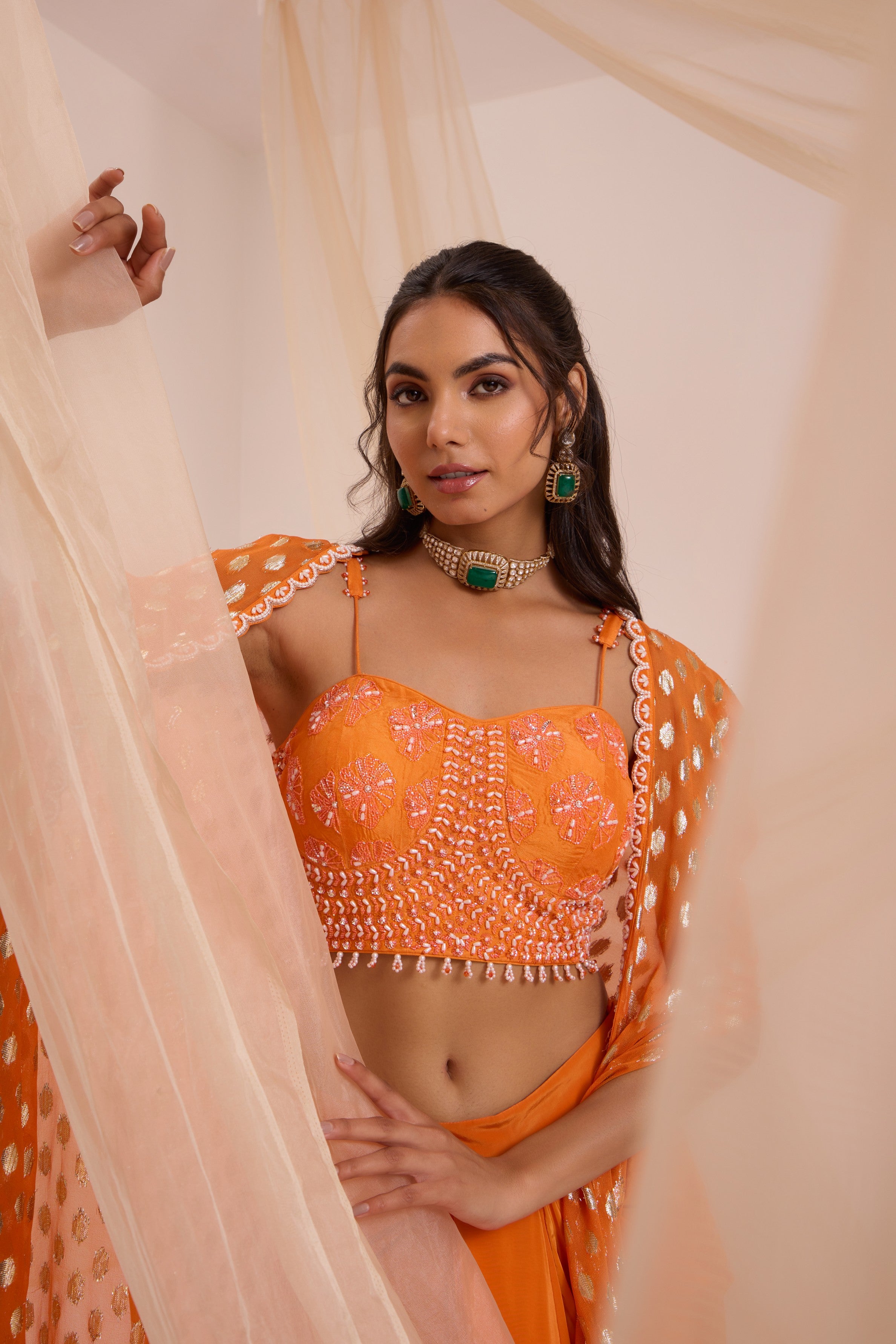 Orange bustier with drape skirt & cape