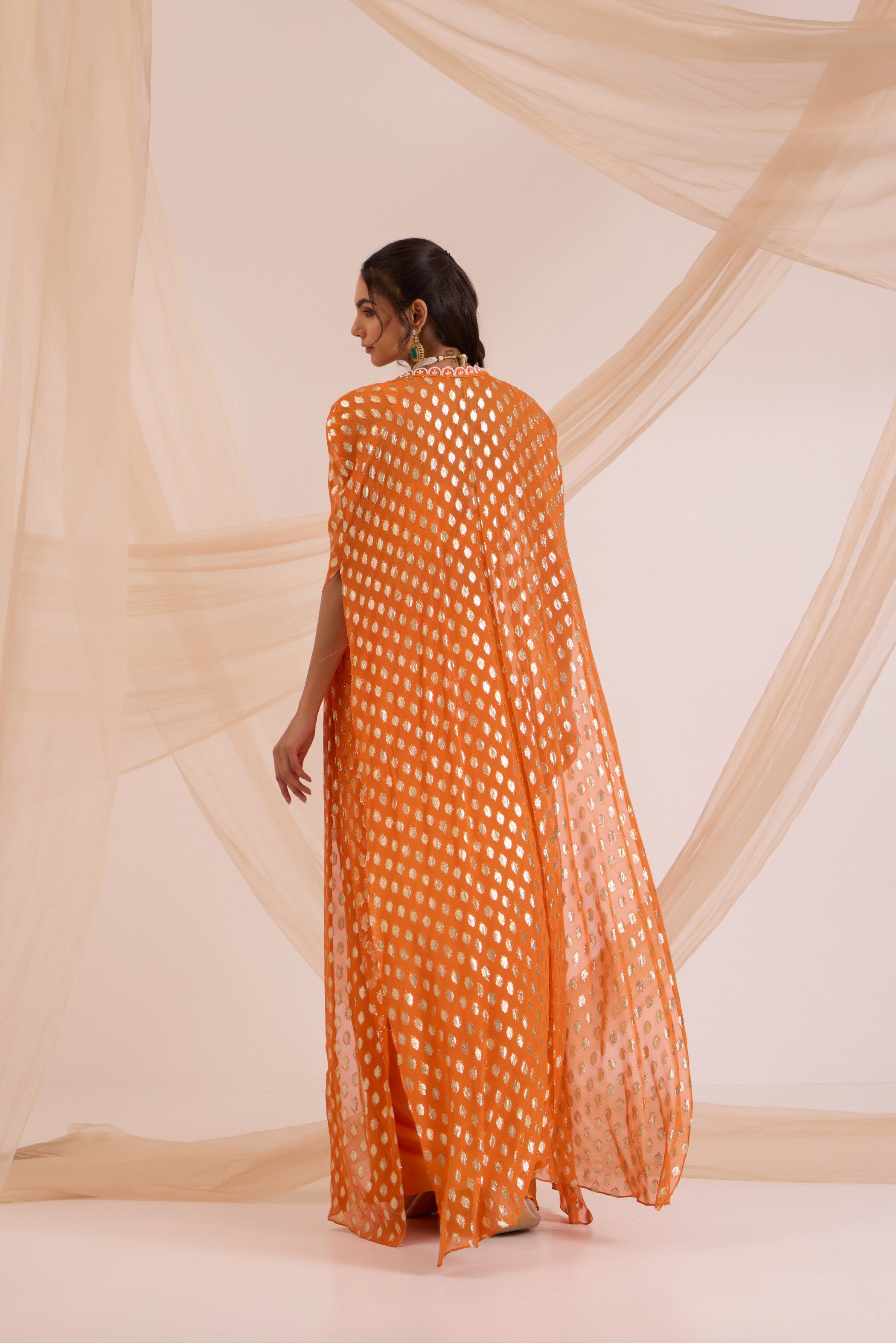 Orange bustier with drape skirt & cape