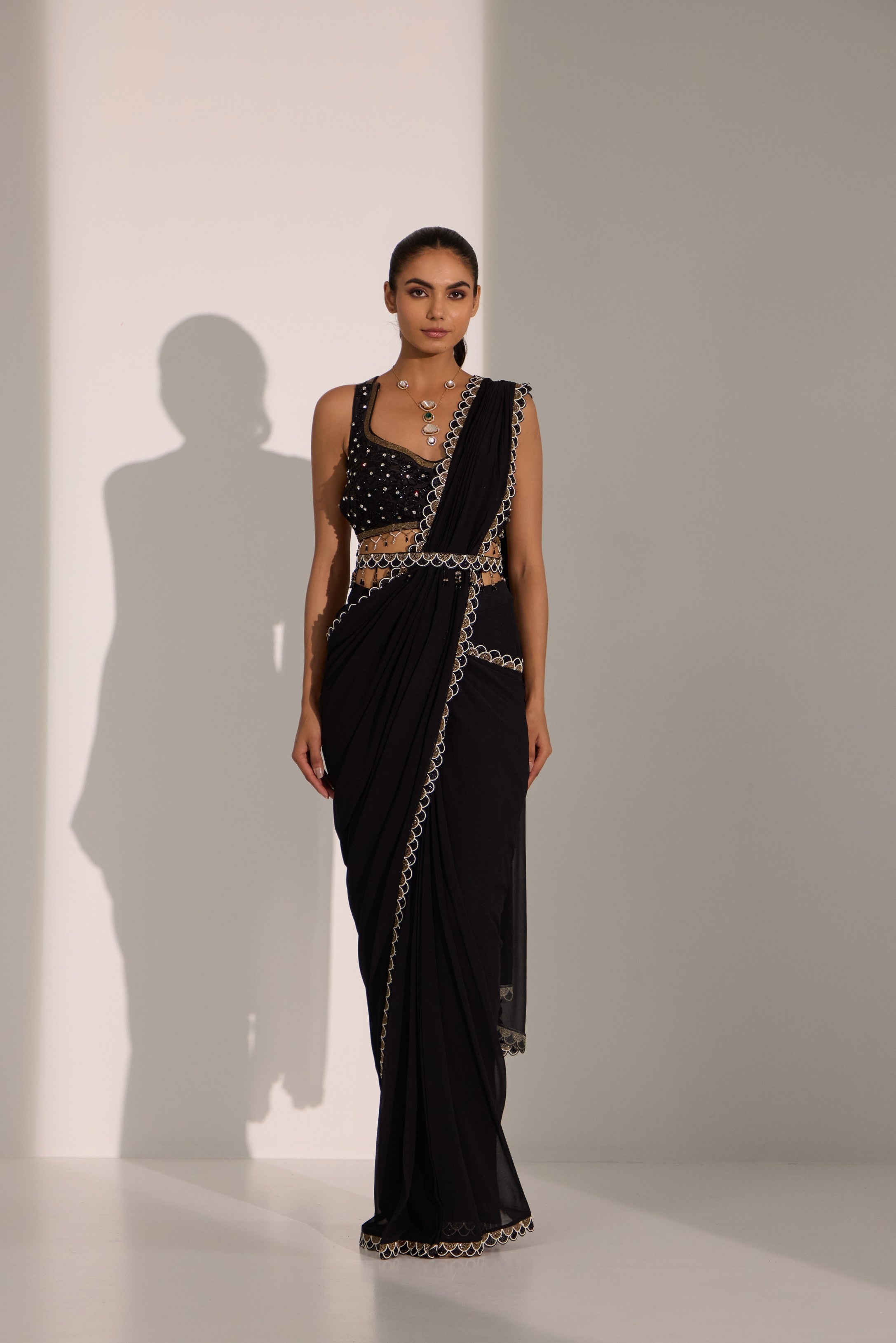 Black drape saree with blouse & detachable belt.
