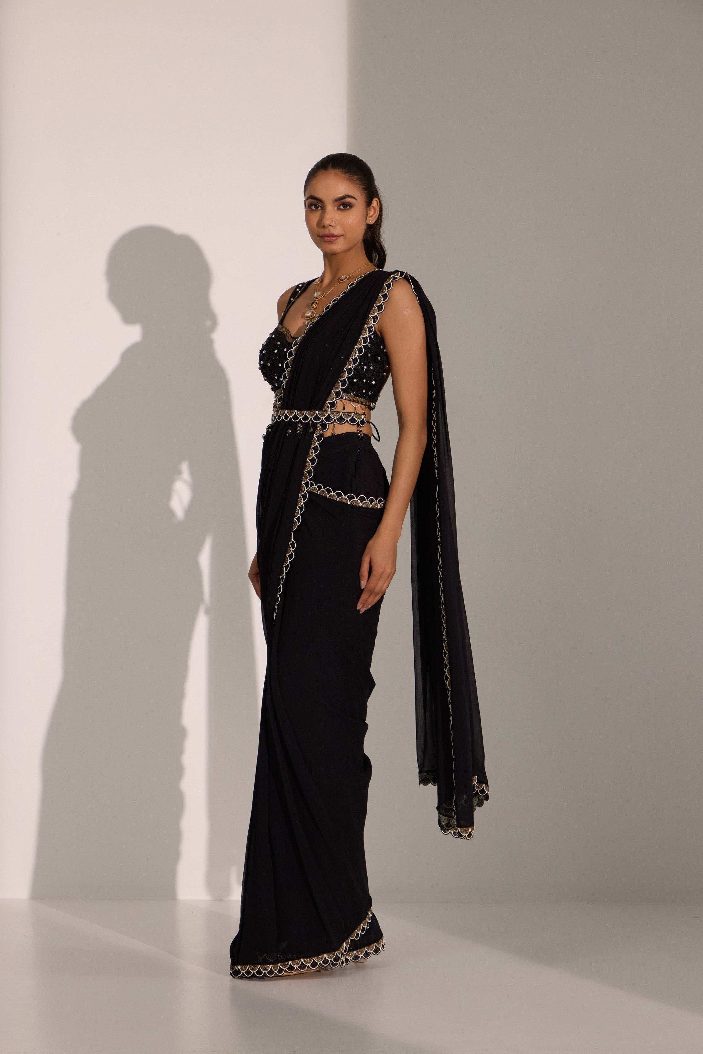 Black drape saree with blouse & detachable belt.