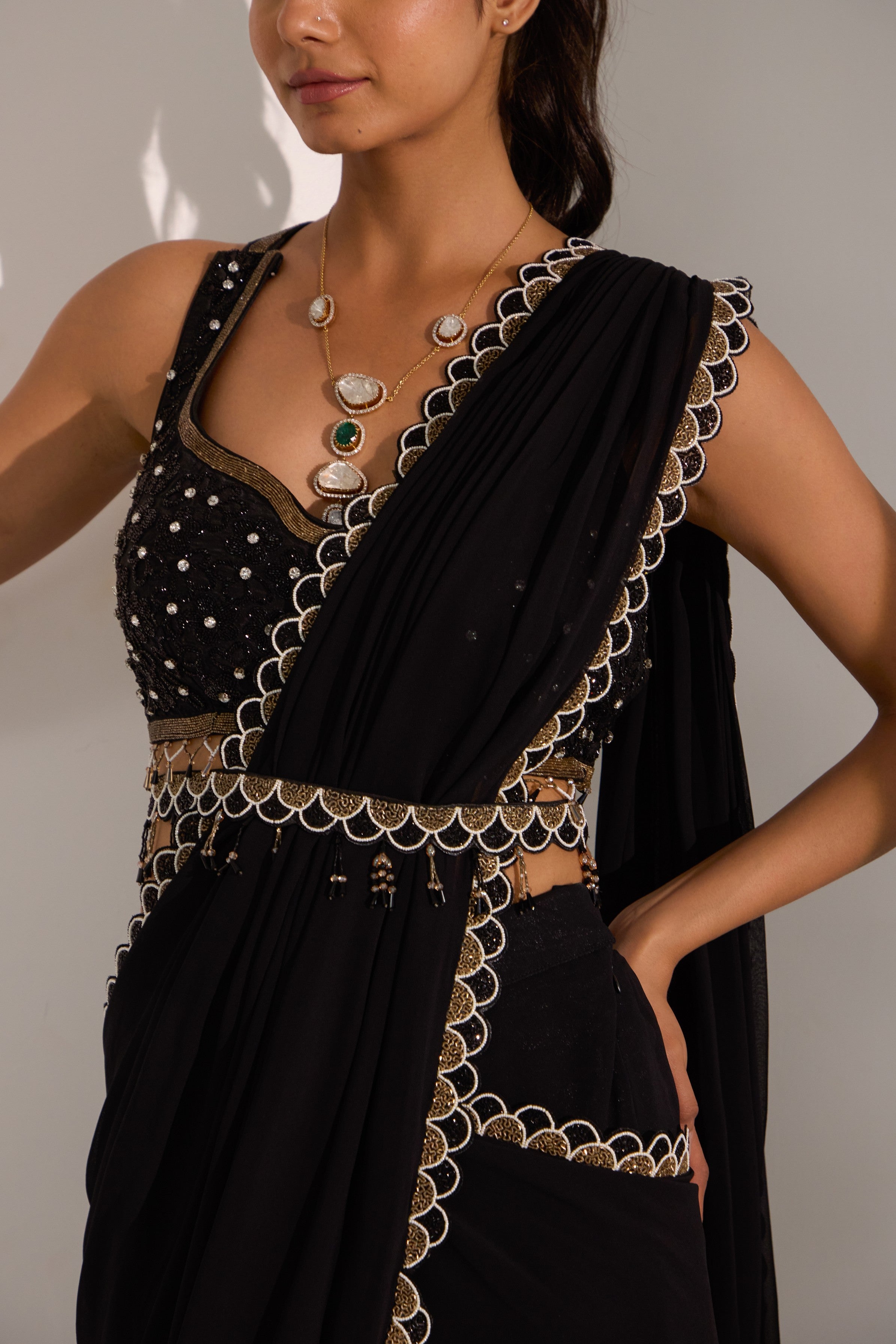 Black drape saree with blouse & detachable belt.