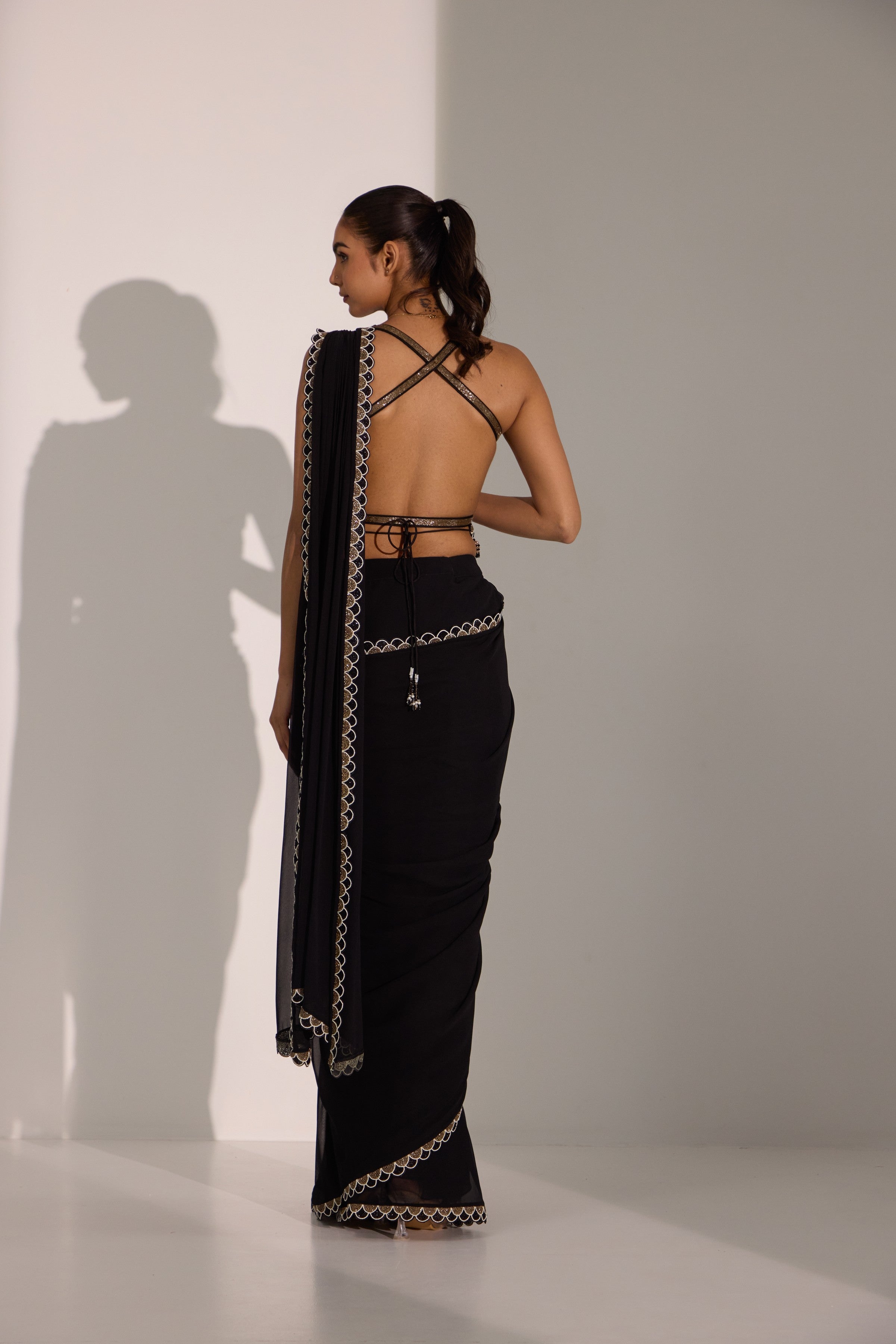 Black drape saree with blouse & detachable belt.