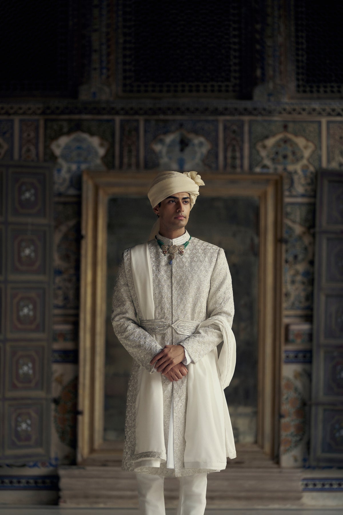 IVORY RAW SILK SHERWANI WITH KURTA AND CHURIDAR WITH OPTIONAL WORKED STOLE, BELT AND EMBROIDERED JUTIS