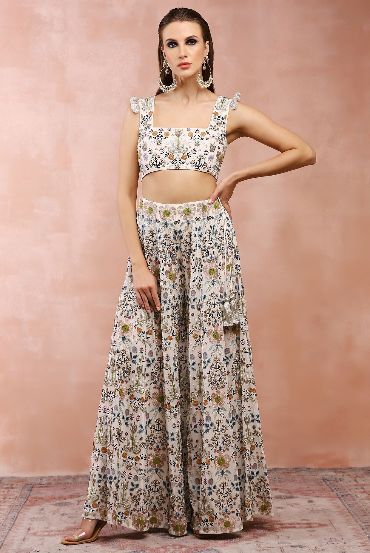 Off white embroidered choli with sharara.