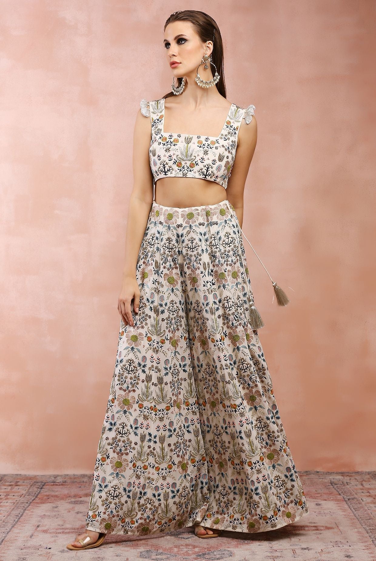 Off white embroidered choli with sharara.