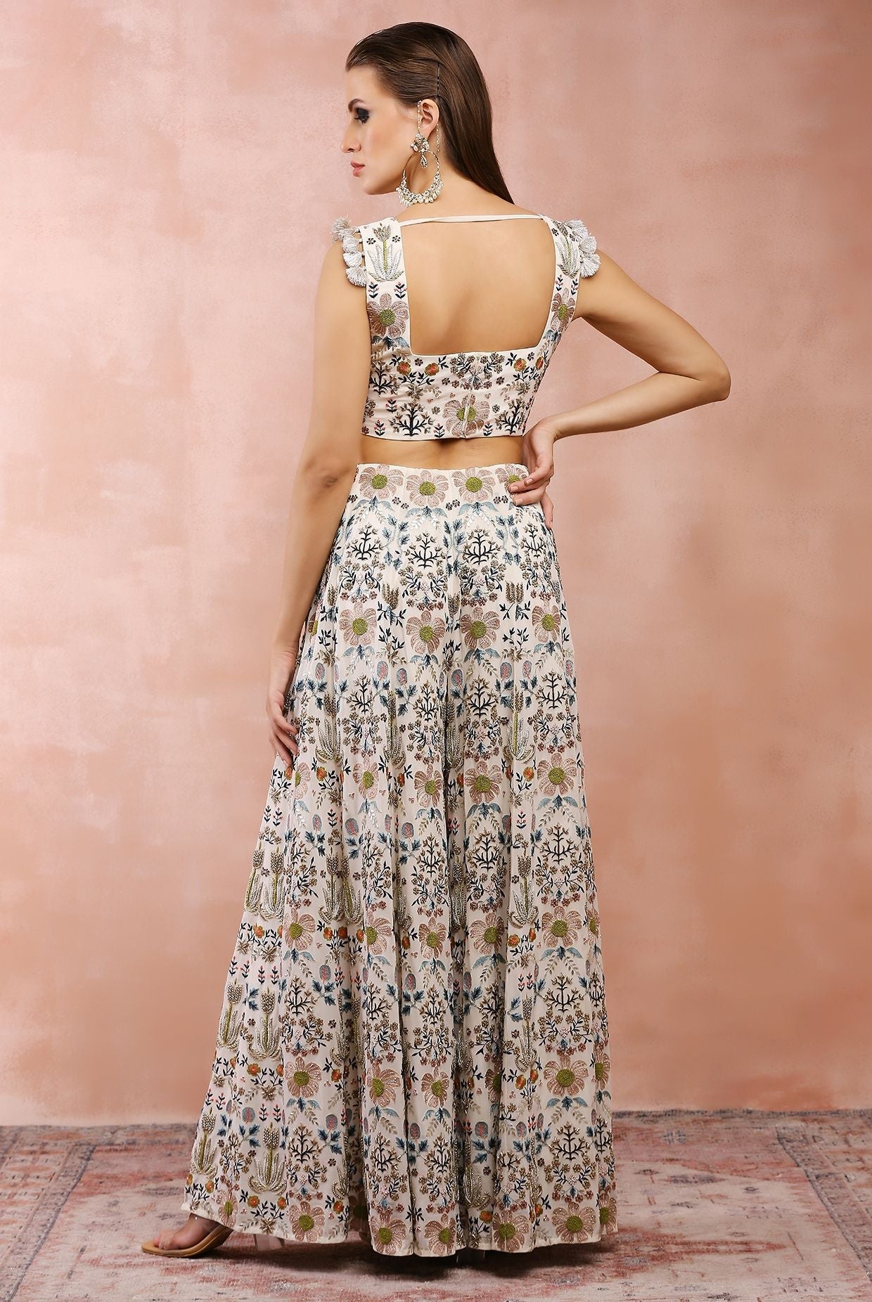 Off white embroidered choli with sharara.