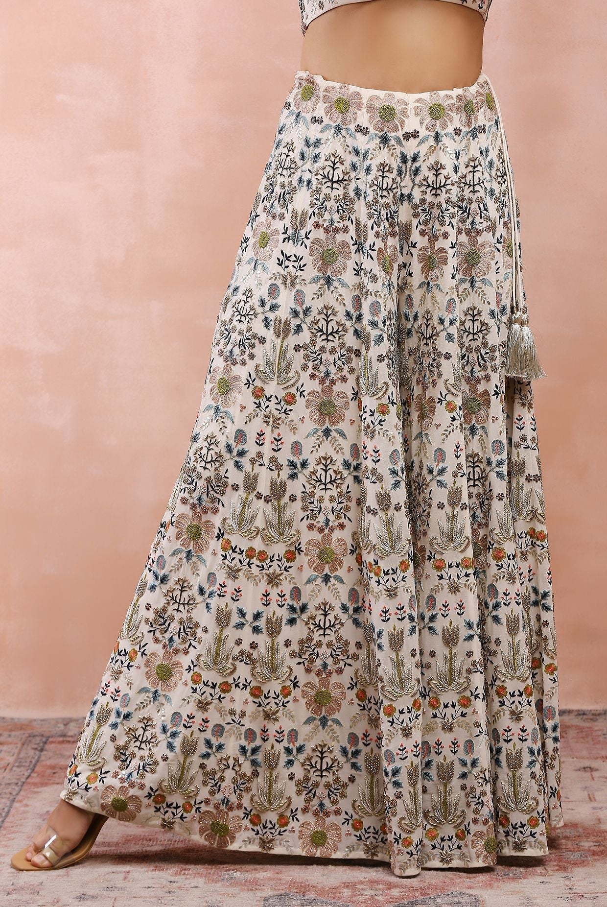 Off white embroidered choli with sharara.