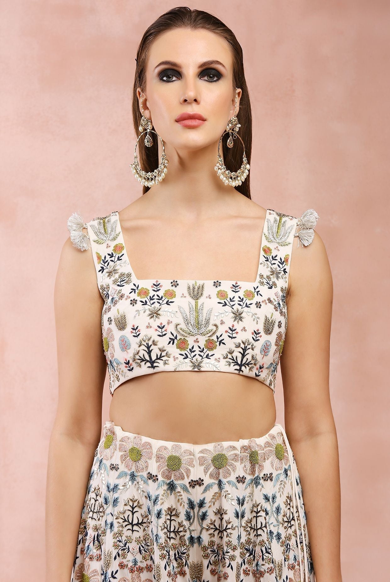 Off white embroidered choli with sharara.