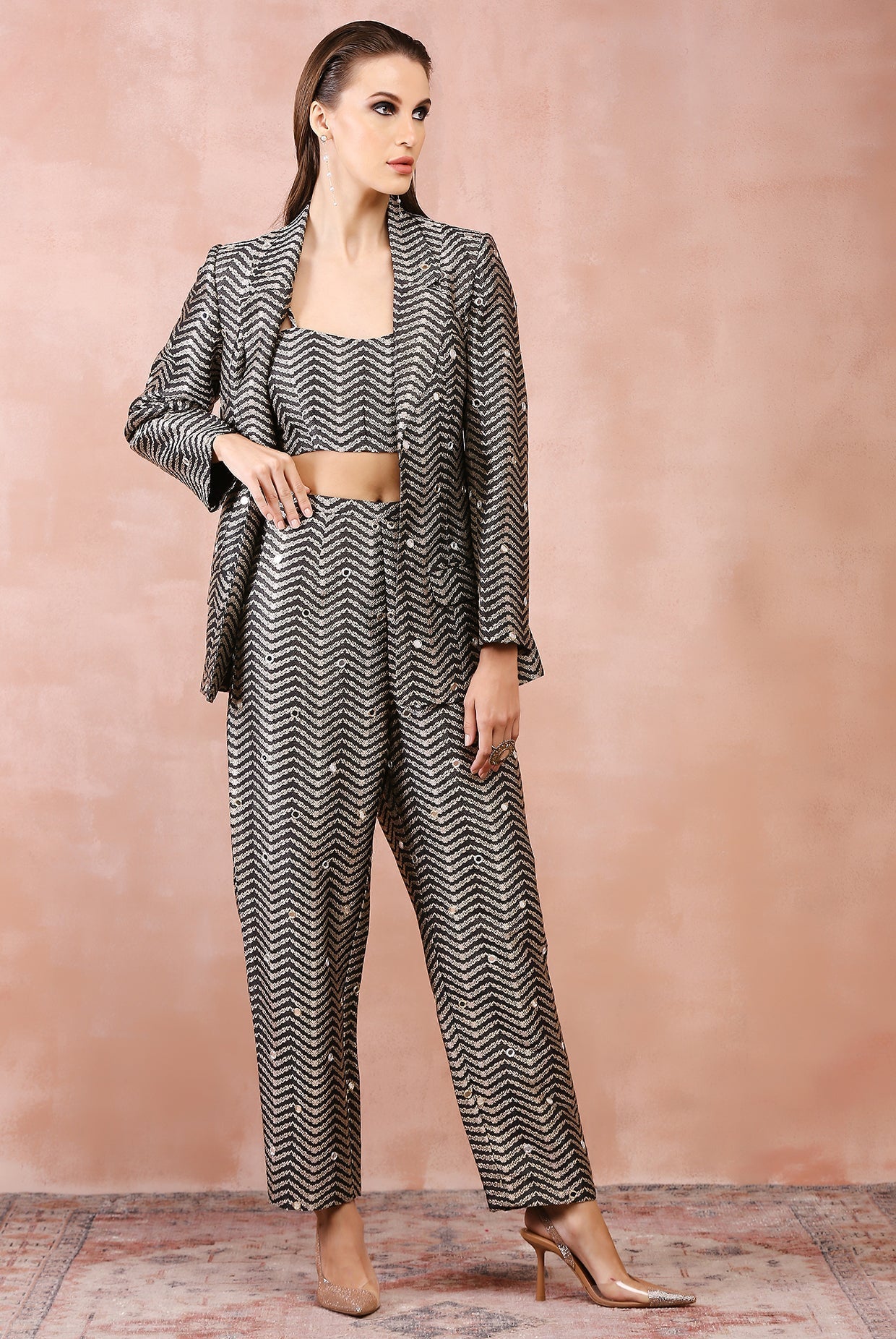 Black embroidered blazer with bustier and pant.