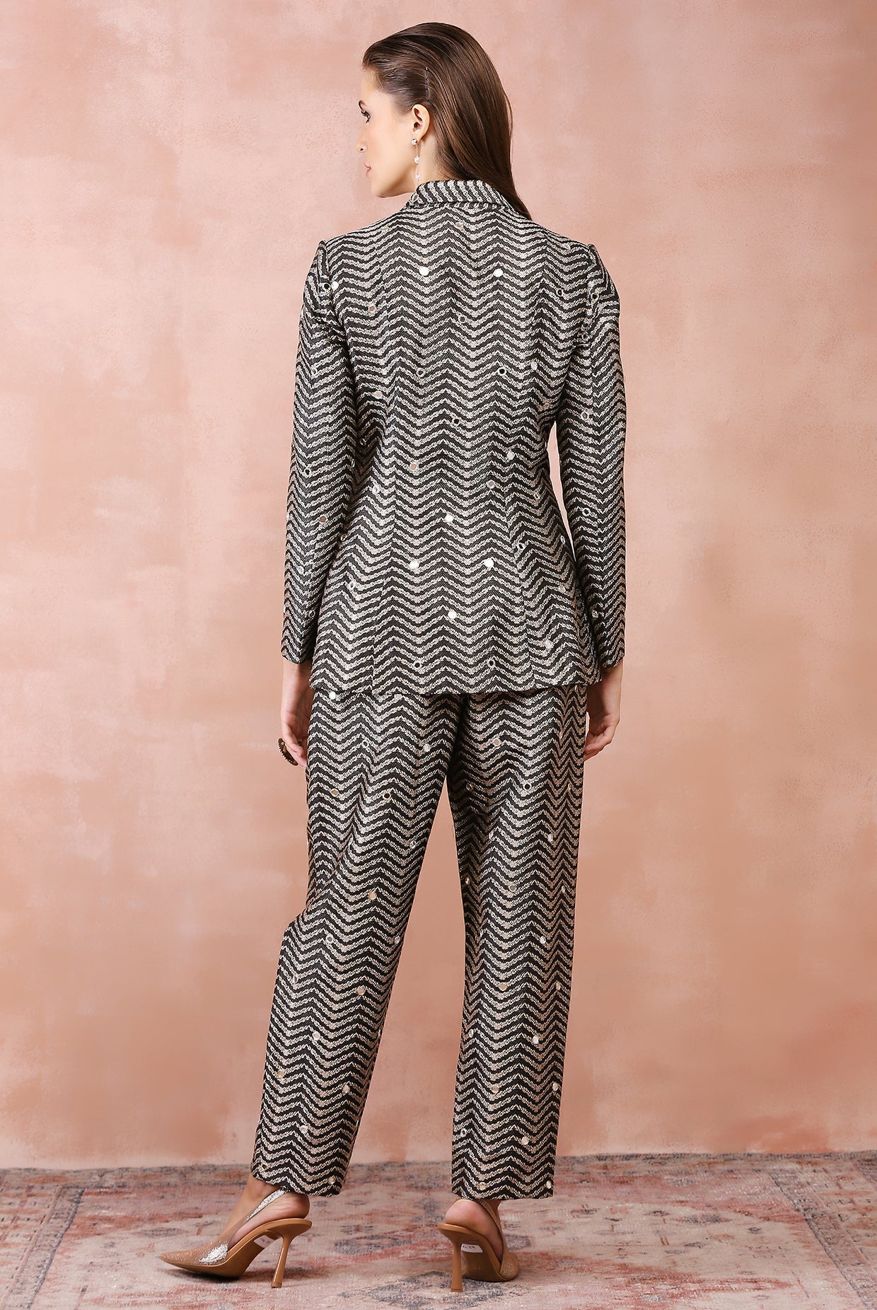 Black embroidered blazer with bustier and pant.