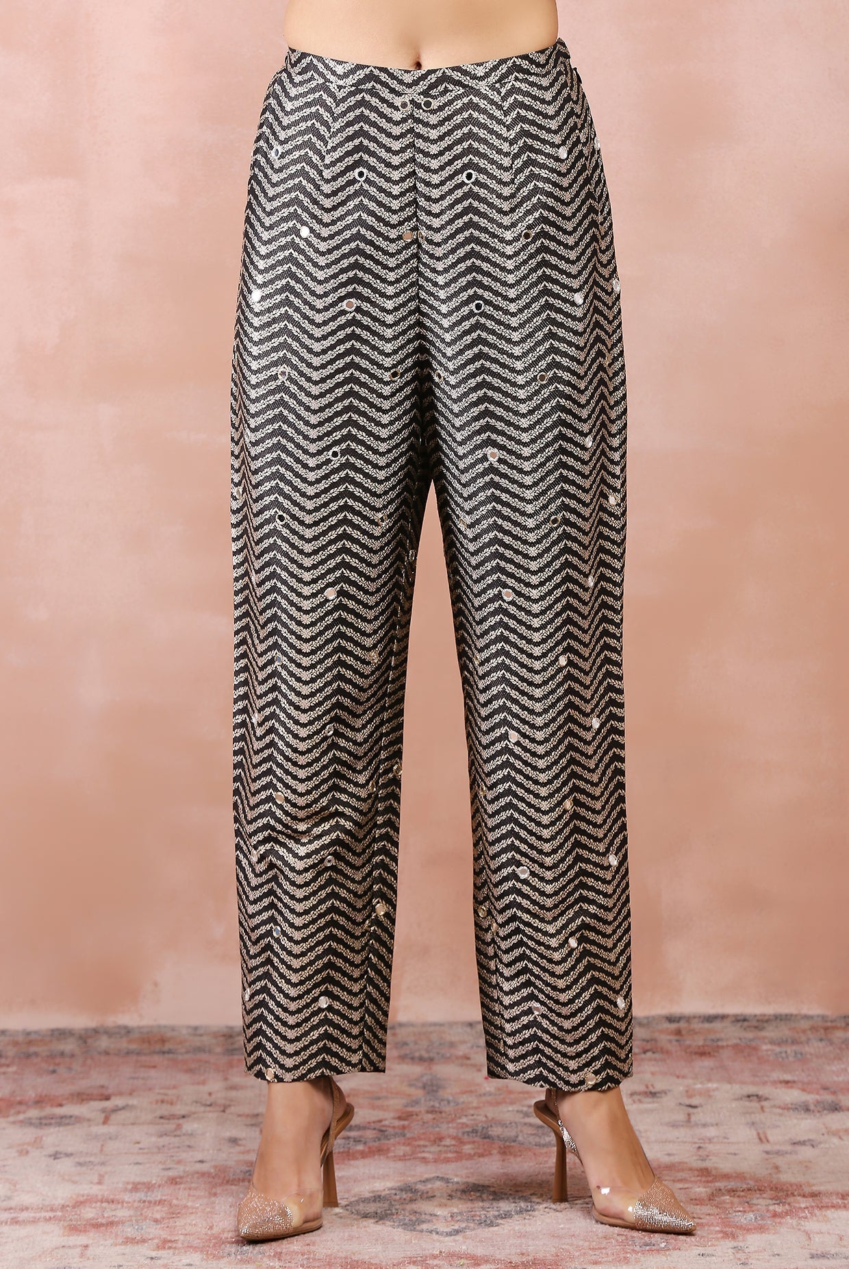 Black embroidered blazer with bustier and pant.